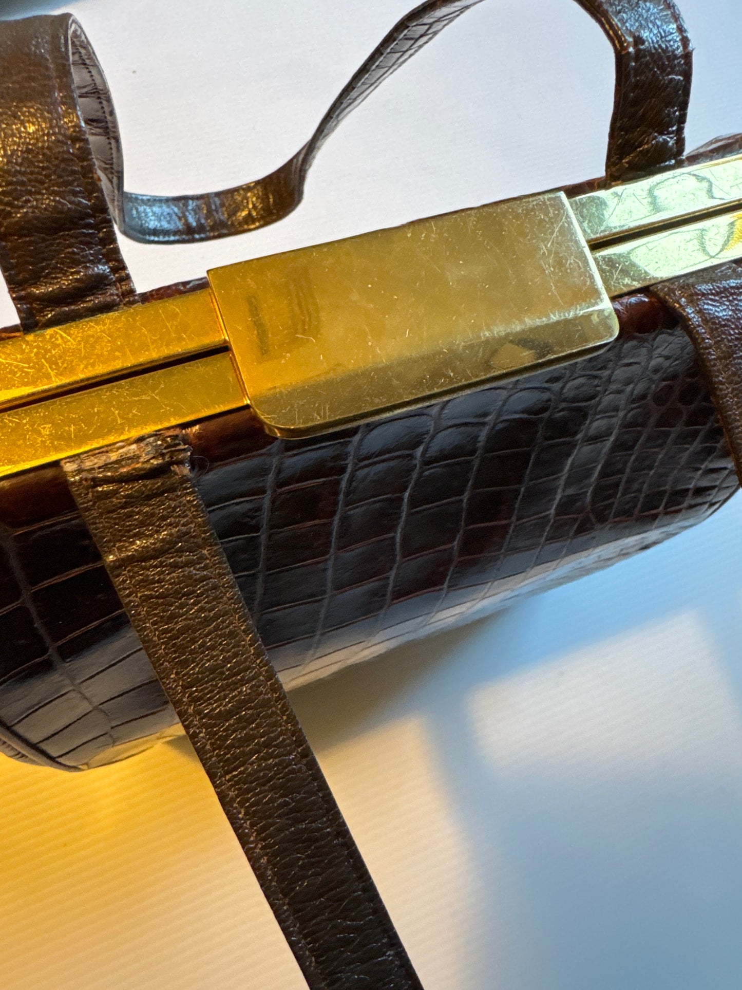 Vintage 50s Deitsch brown alligator double handle handbag. lined in a brown leather with  pockets on both sides and comes with a mirror, comb and attached coin purse.