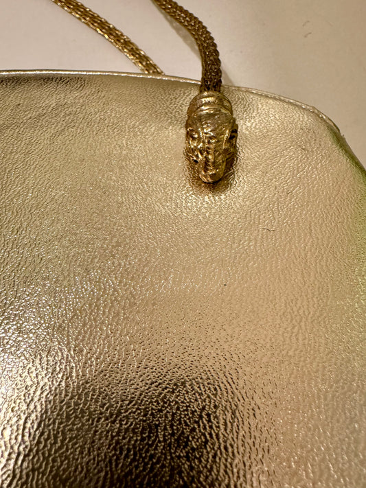 Stunning gold bag with rams head hardware and gold mesh shoulder chain