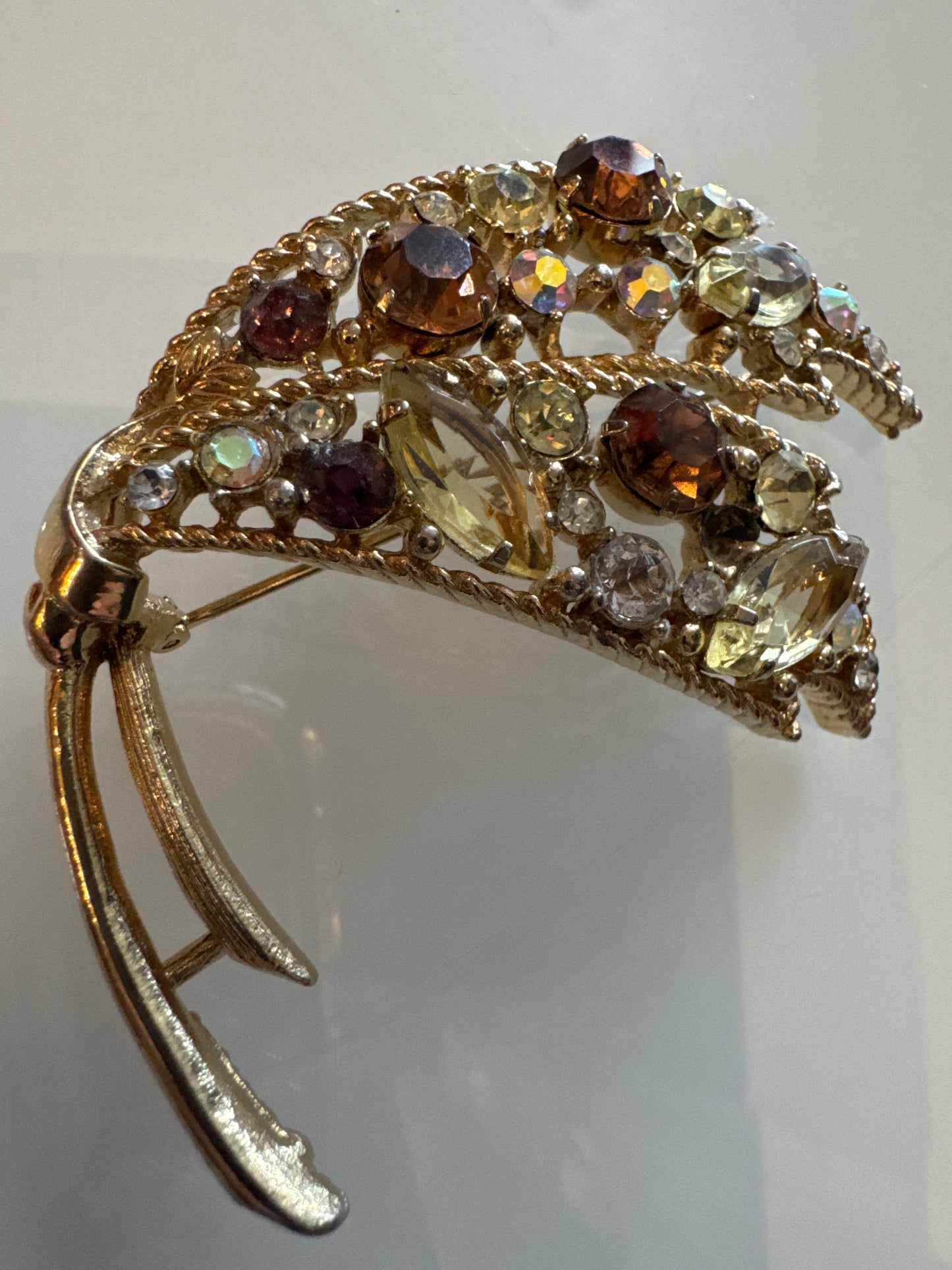 Beautiful jumbo signed EMMON gold tone brooch with Amber and pastel colored rhinestones. Is it a butterfly wing?