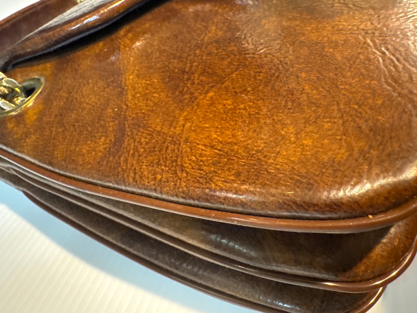 fabulous 1960s brown vinyl triple compartment handbag with chains and decorative closure