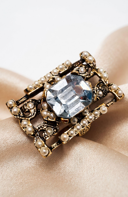 elegant 1940s jumbo cocktail ring with faux aquamarine  center stone  and seed pearls.