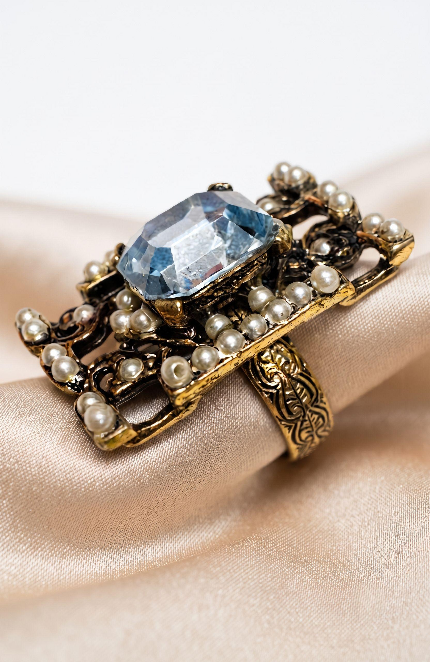 elegant 1940s jumbo cocktail ring with faux aquamarine  center stone  and seed pearls.