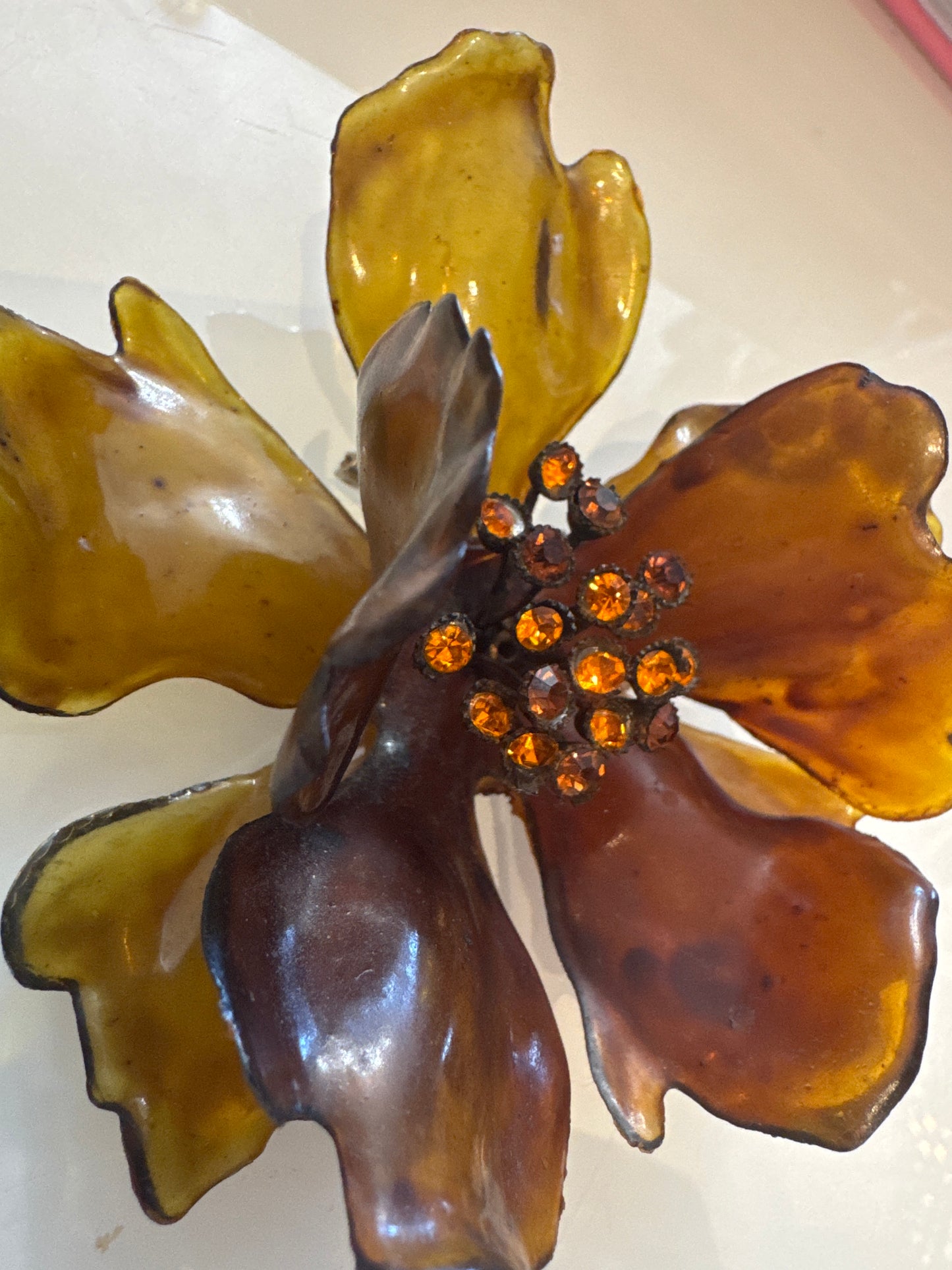 1960s giant amber colored lucite brooch with center rhinestones