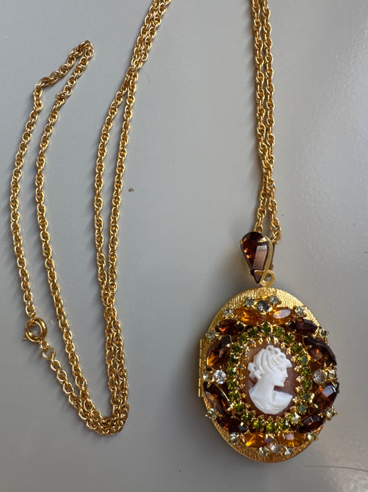 Stunning vintage cameo locket with rhinestones in amber. Signed Hobe . Tom