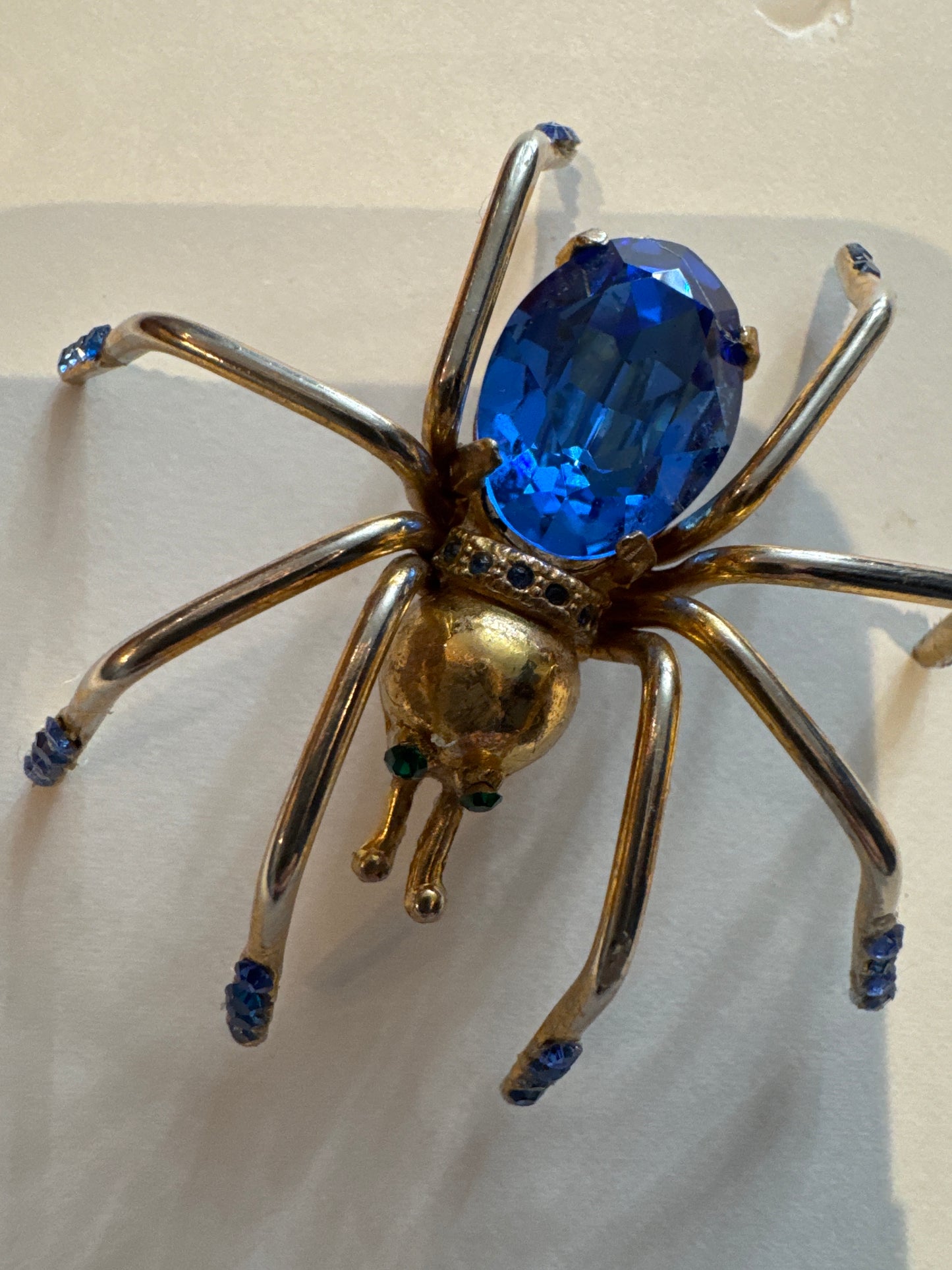 Little Miss spider, gold tone brooch with blue and green rhinestones. NYC