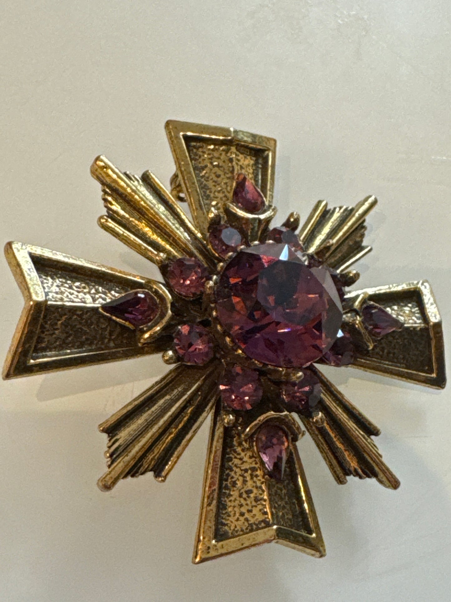 signed Zentall 1990s maltese cross brooch with amethyst colored stones