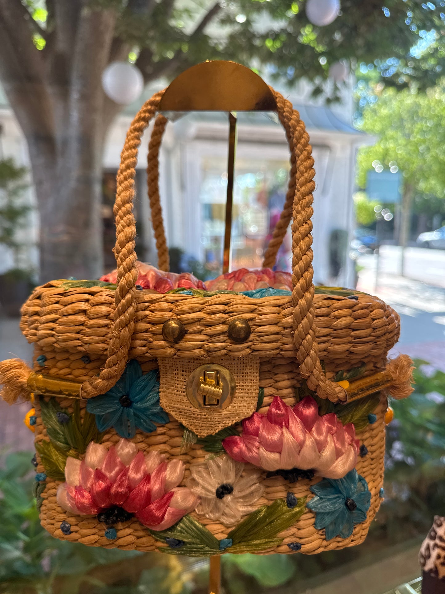 Beautiful 1960s wicker bag with pink yellow and turquoise flowers. Rope handle.