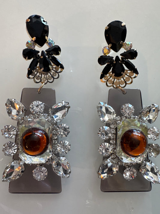 jumbo statement earrings from Paris, featuring gray plexi with rhinestones. Source in Paris. Paris live.