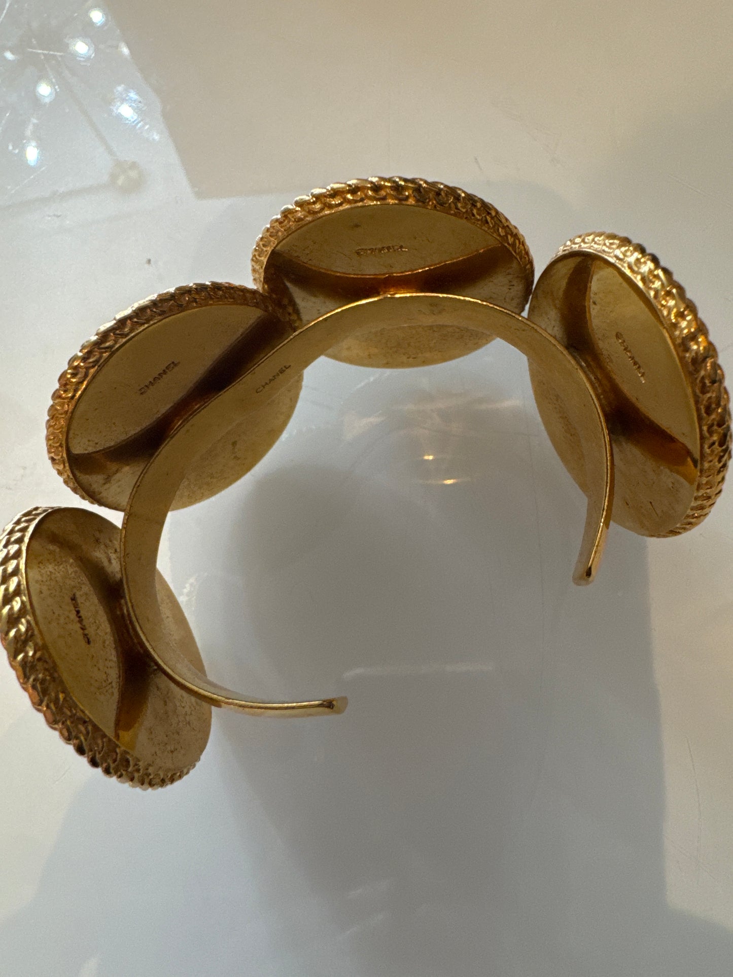 Chanel 1990s carved cameo motif large cuff bracelet with 4-cameo 2" cameo plates featuring a horse, 2 Coco portraits and a renaissance girl.