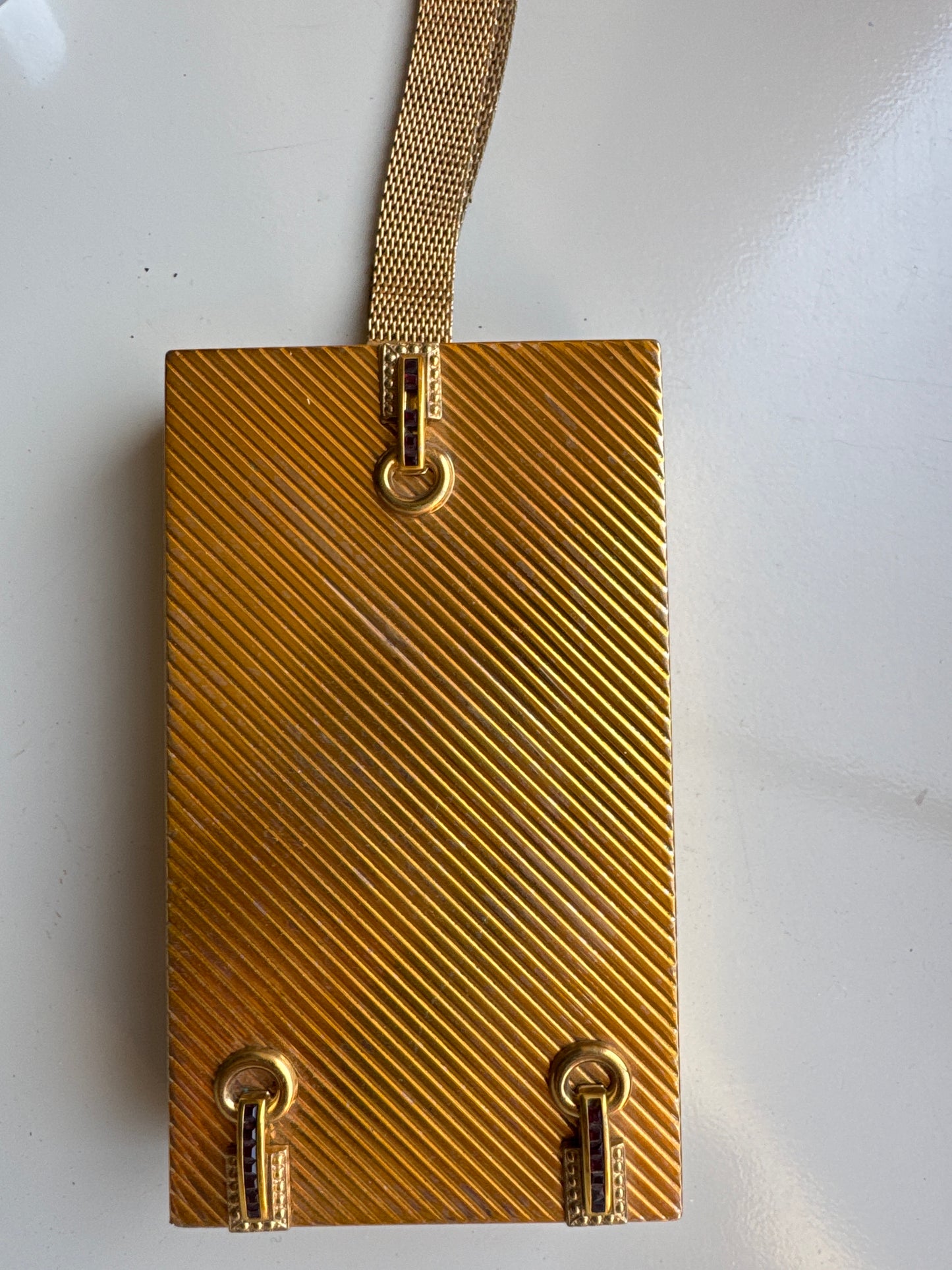Beautiful gold tone, 1930s double-sided MINAUDIERE. One side, Makeup one side cigarettes. Beautiful rhinestone detailing on the outside. Signed Evans.Tom