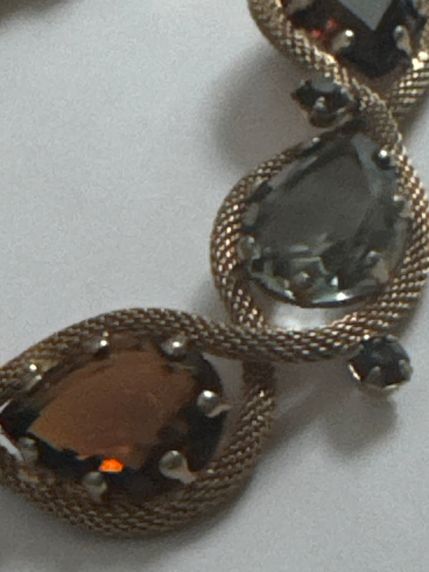 1950s signed HATTIE CARNAGIE smoky gray, and topaz bracelet with delicate gold tone rope motif  throughout