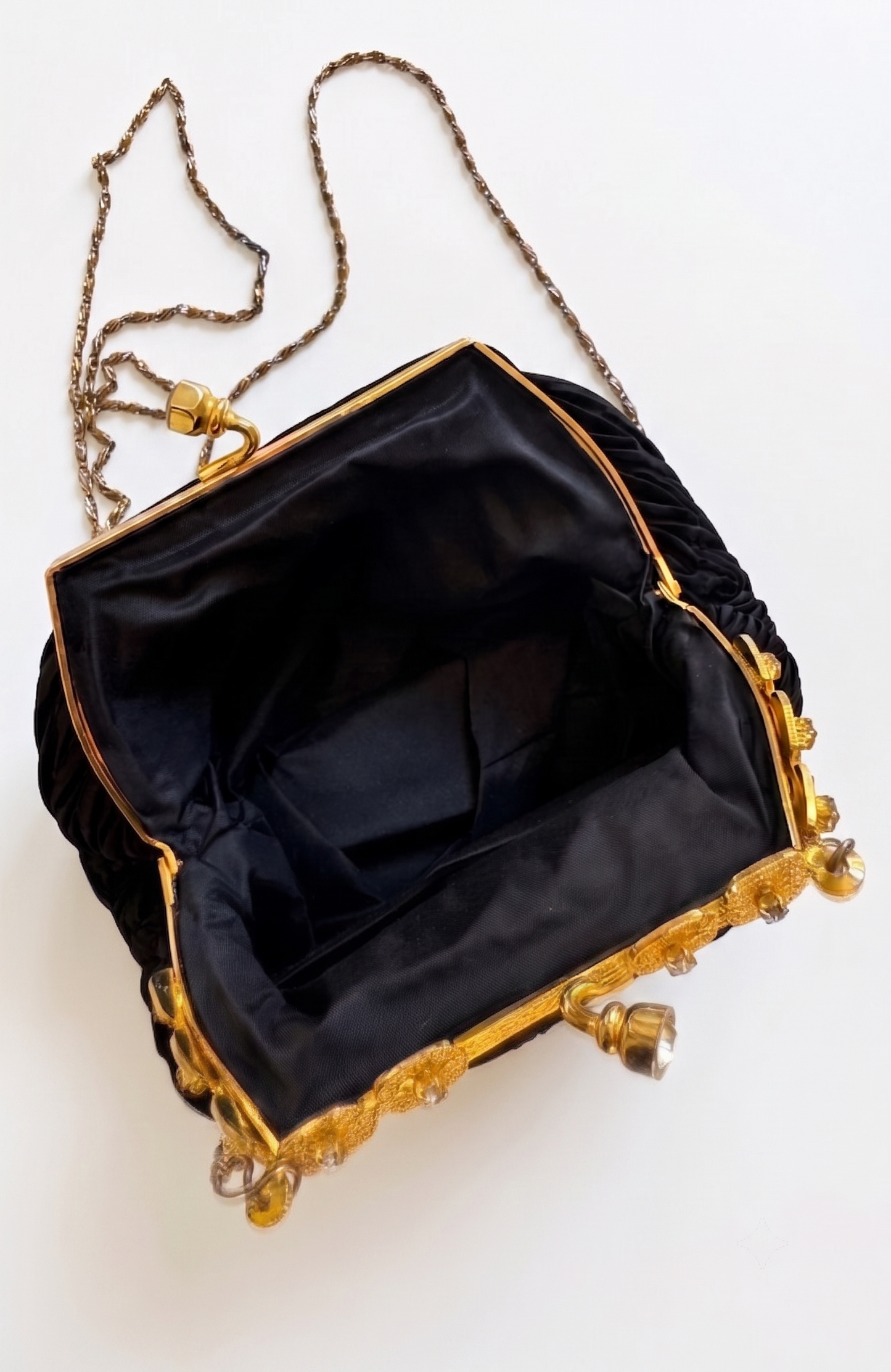 Elegant 1960s plisse black silk minaudiere evening bag with beautiful gold hardware and strap long enough for Crossbody