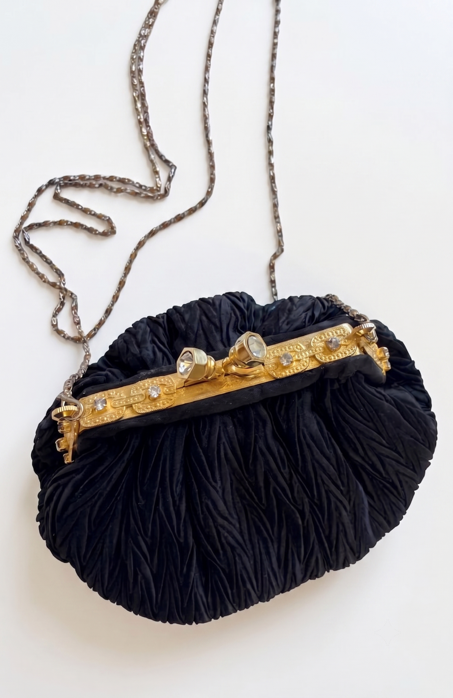 Elegant 1960s plisse black silk minaudiere evening bag with beautiful gold hardware and strap long enough for Crossbody