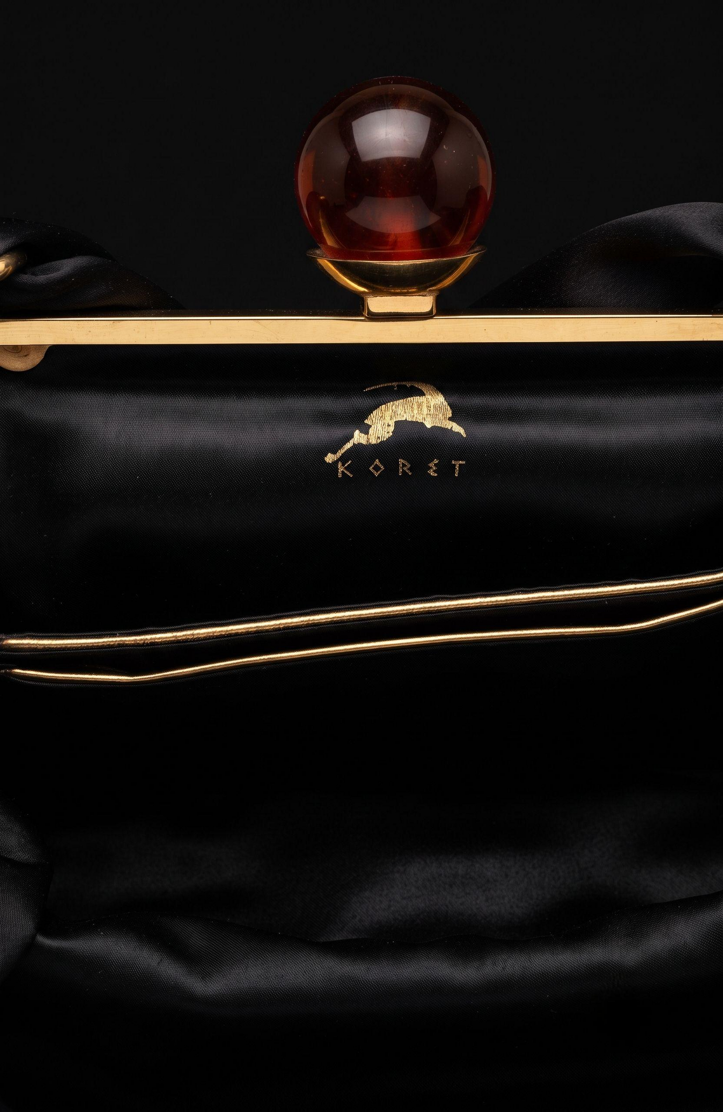 Bag is black suede 1940s with a bakelite top clasp