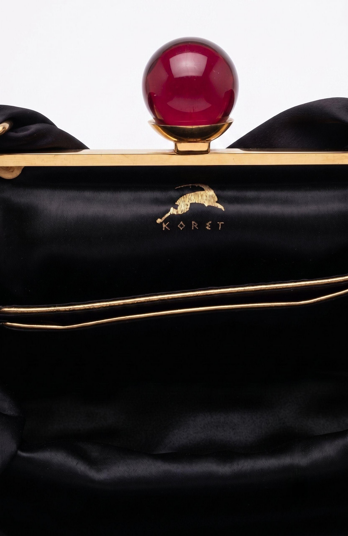Bag is black suede 1940s with a bakelite top clasp