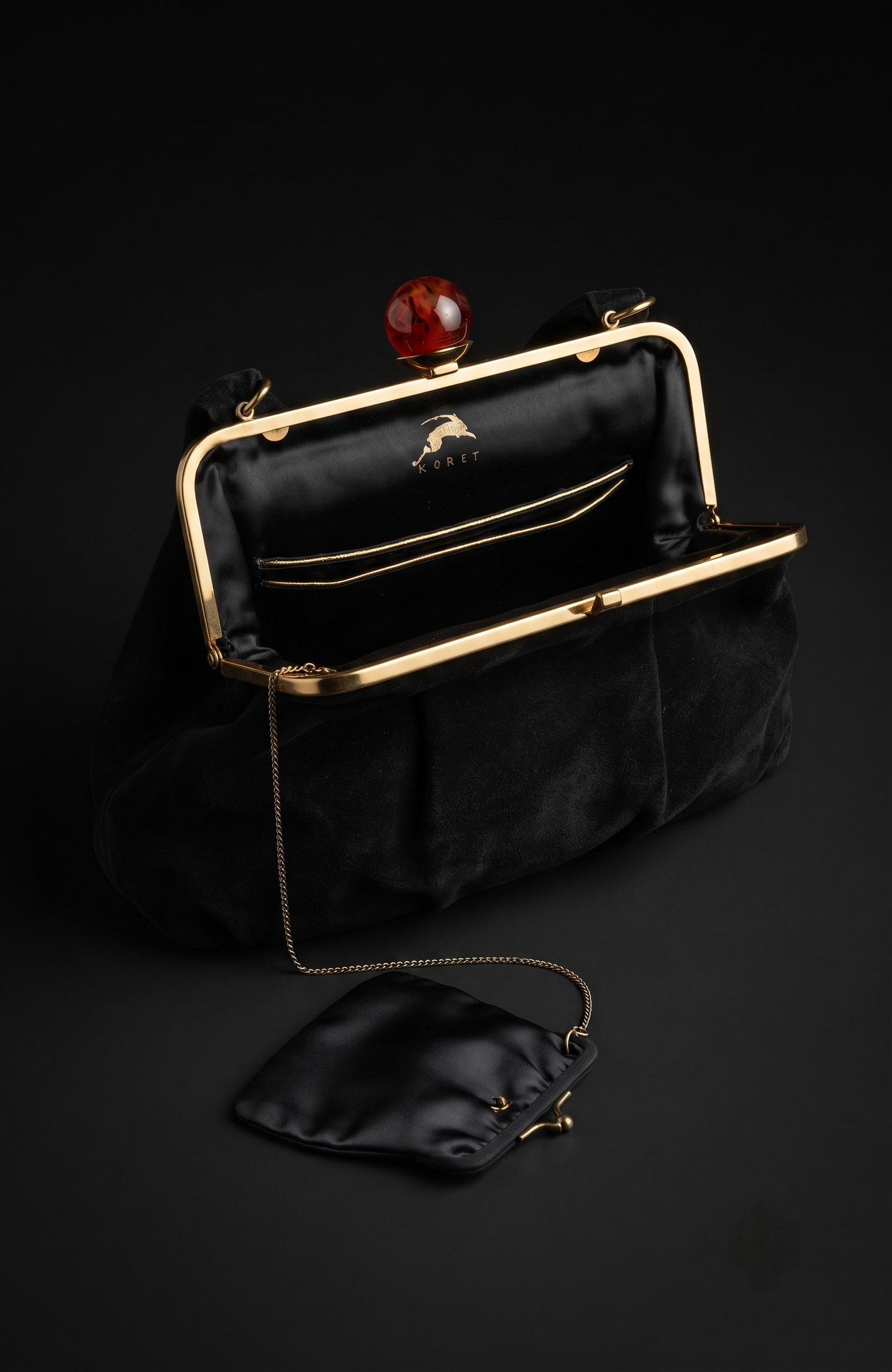 Bag is black suede 1940s with a bakelite top clasp