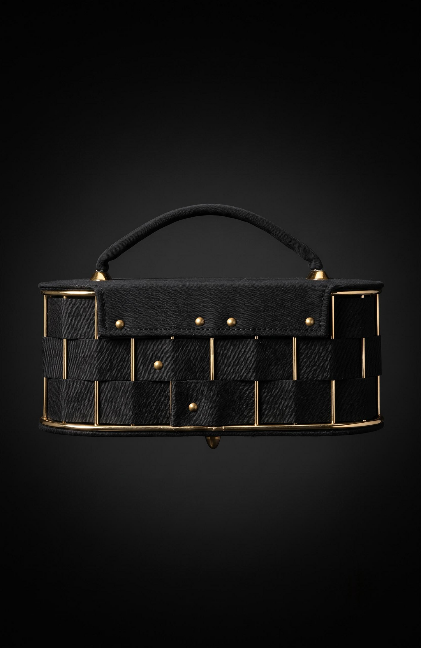 It is a 1940s black suede box Bag with woven suede and gold tone detailing