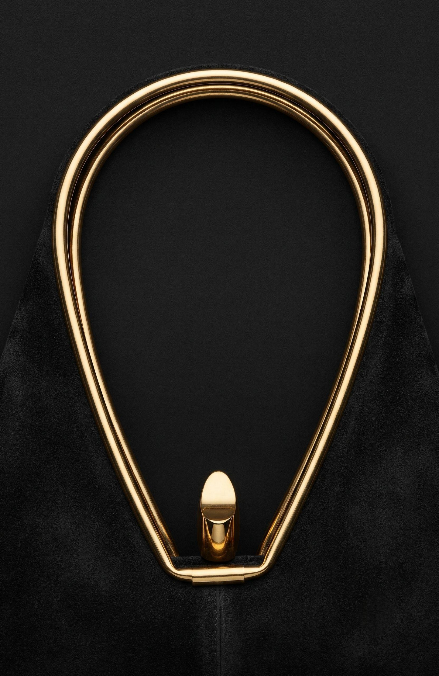 Geometric suede Bag from the 1940s with gold-tone details, it is black.