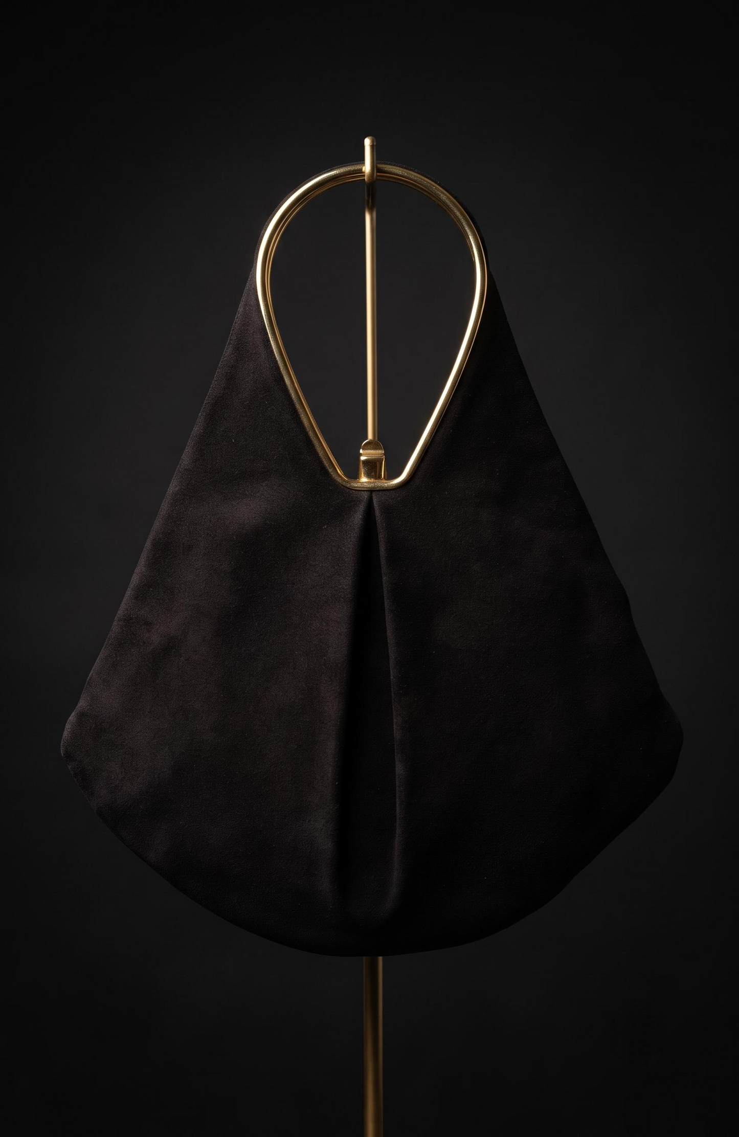 Geometric suede Bag from the 1940s with gold-tone details, it is black.
