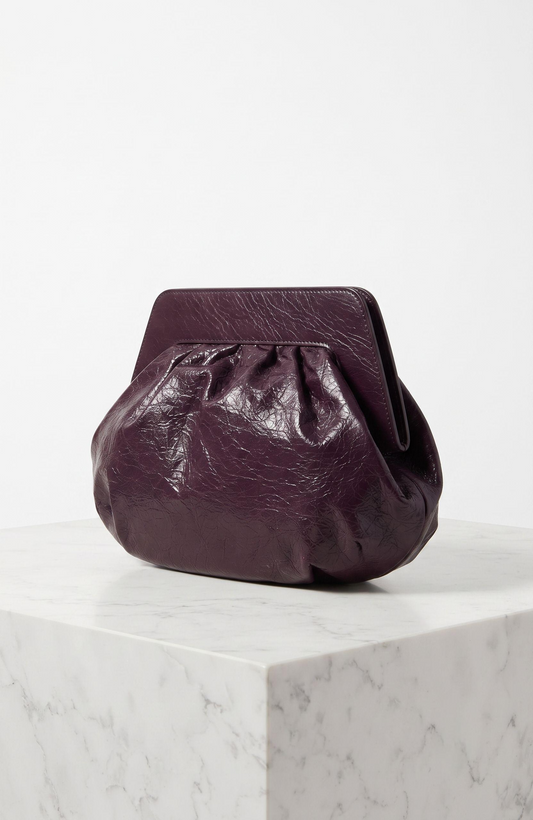 Vintage 1980s burgundy colored clutch bag with attachable shoulder strap