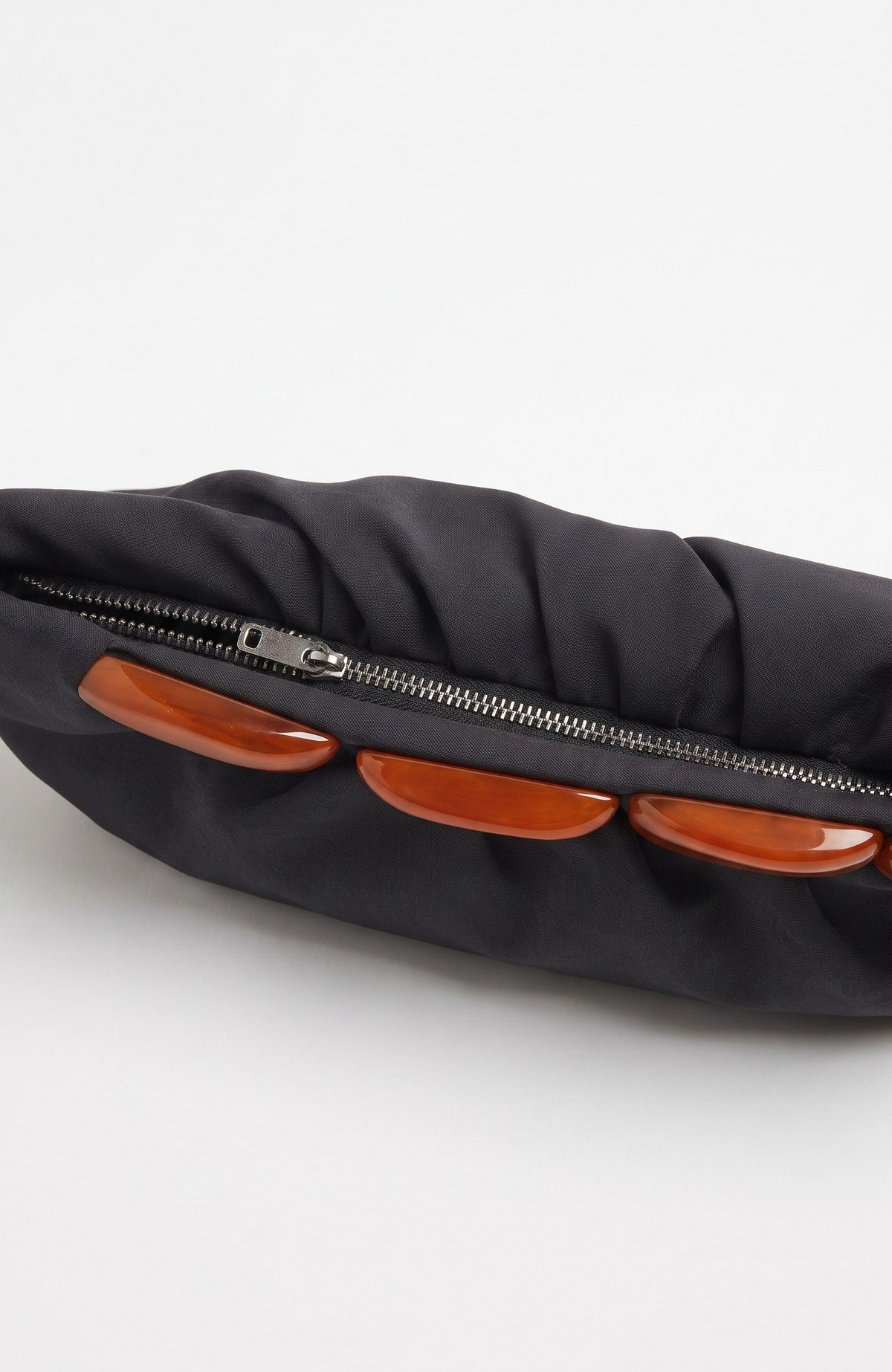 1940s black long clutch with a beautiful bakelite detail