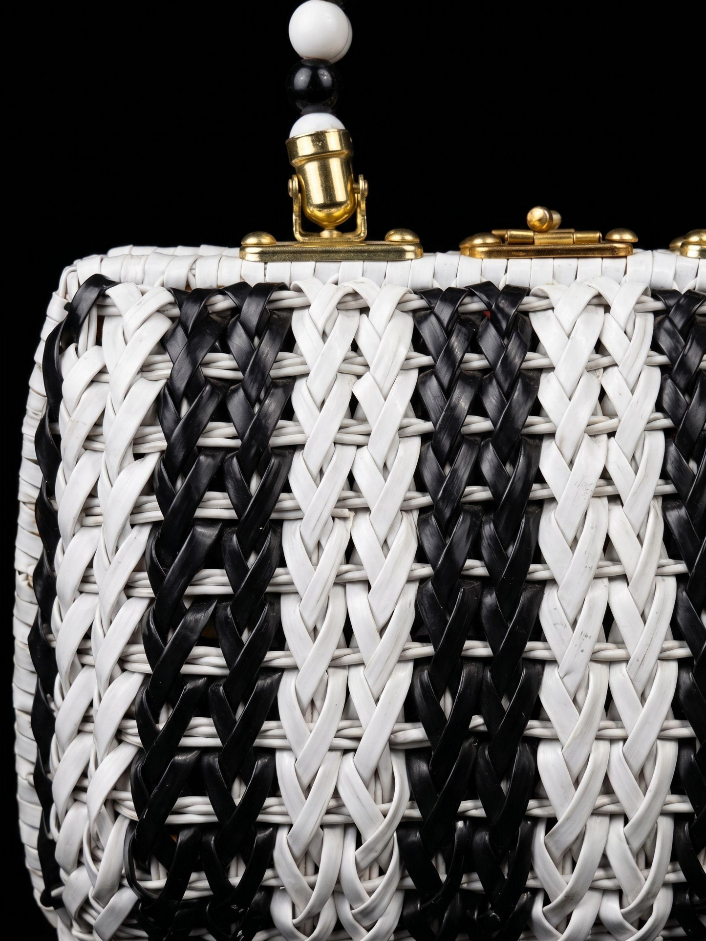 Beautiful 1950s black and white wicker top handle bag with beaded handle and fabric interior