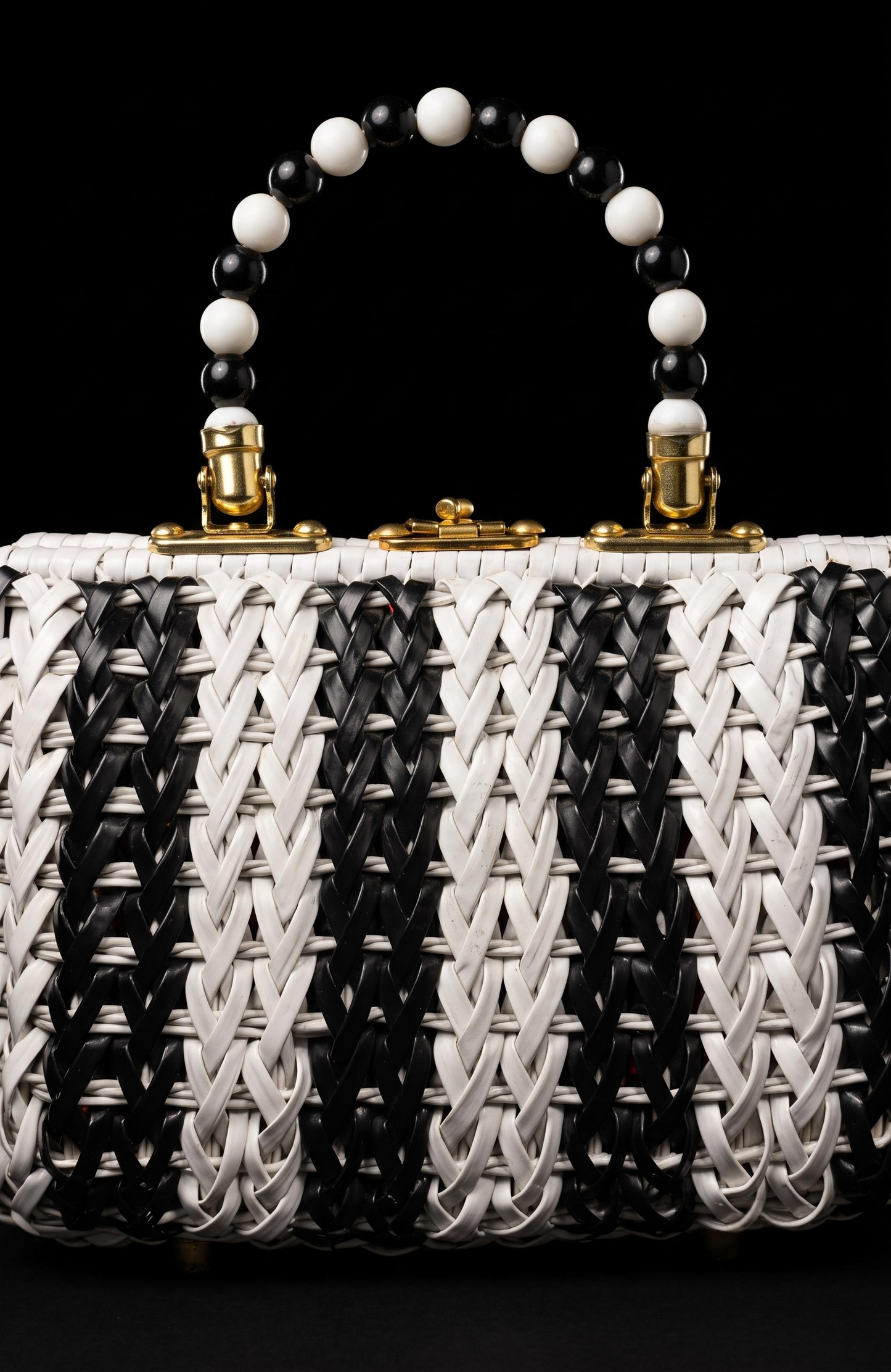 Beautiful 1950s black and white wicker top handle bag with beaded handle and fabric interior