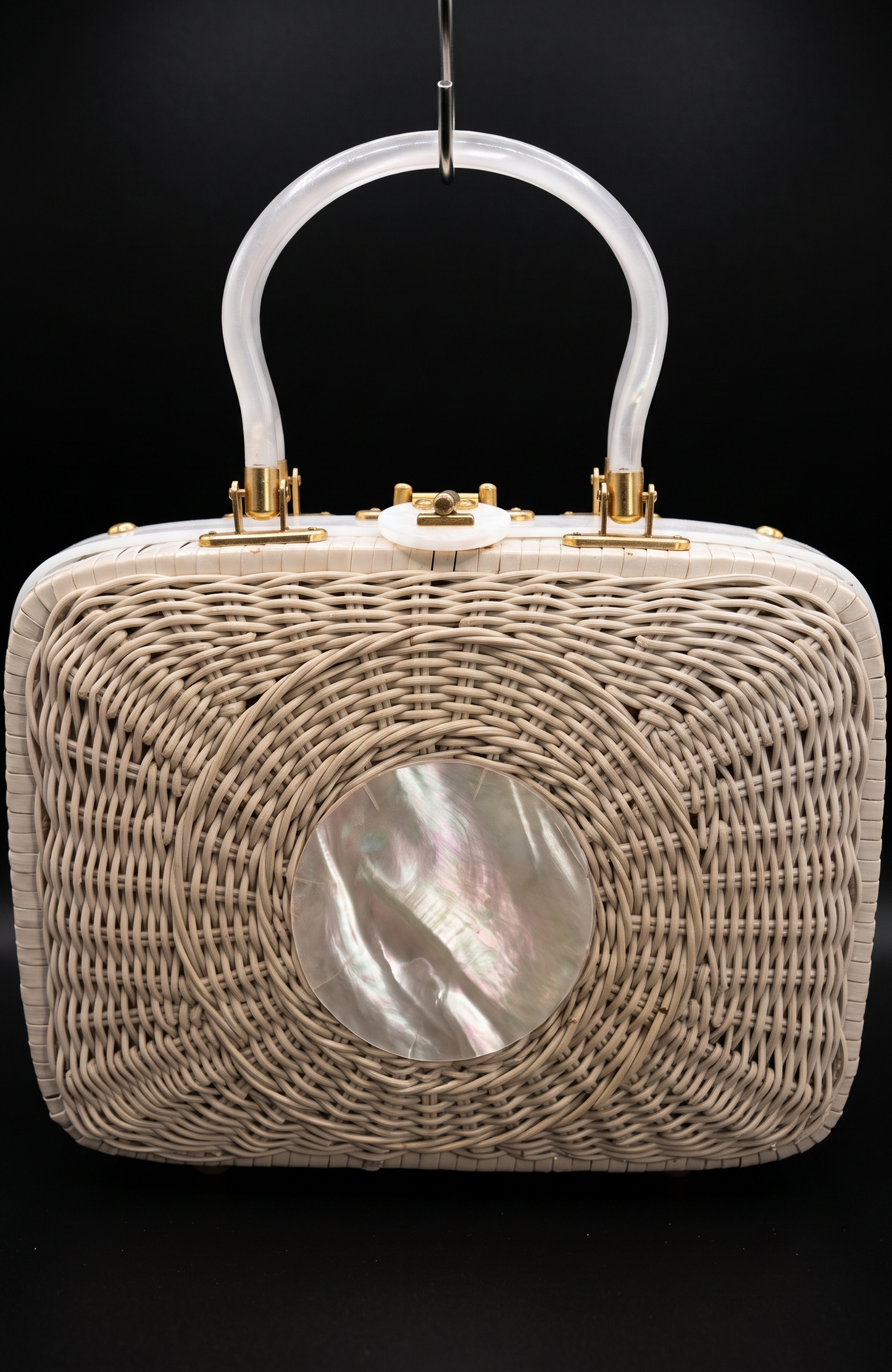 Beautiful 1950s white wicker  bag with mother of pearl in the center and lucite handles