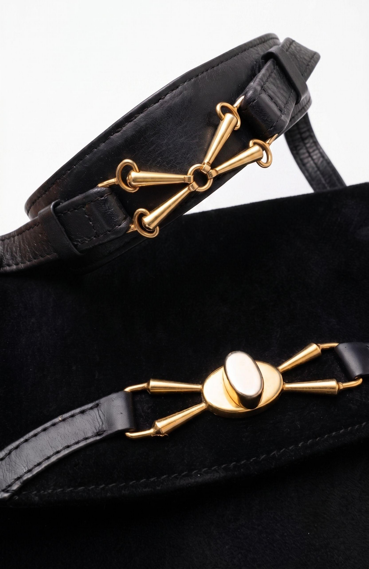 Stunning 1970s black suede with gold hardware shoulder bag. RARE and unique.