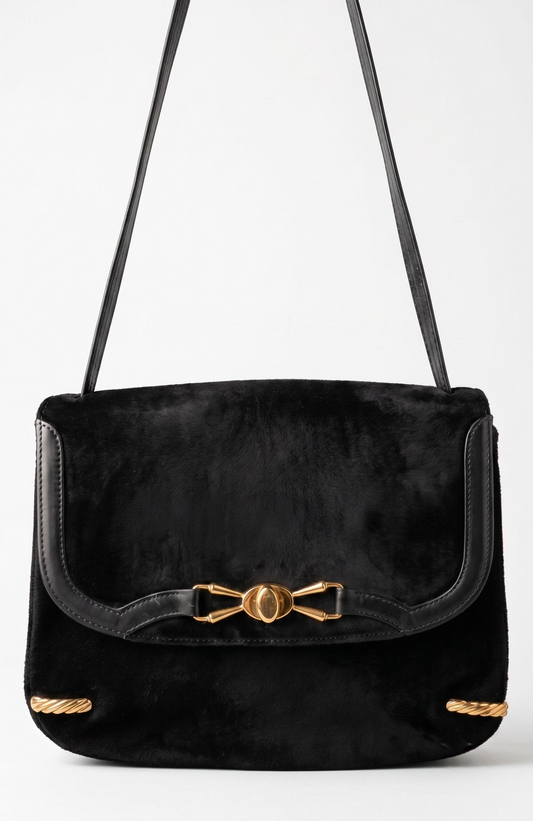 Stunning 1970s black suede with gold hardware shoulder bag. RARE and unique.