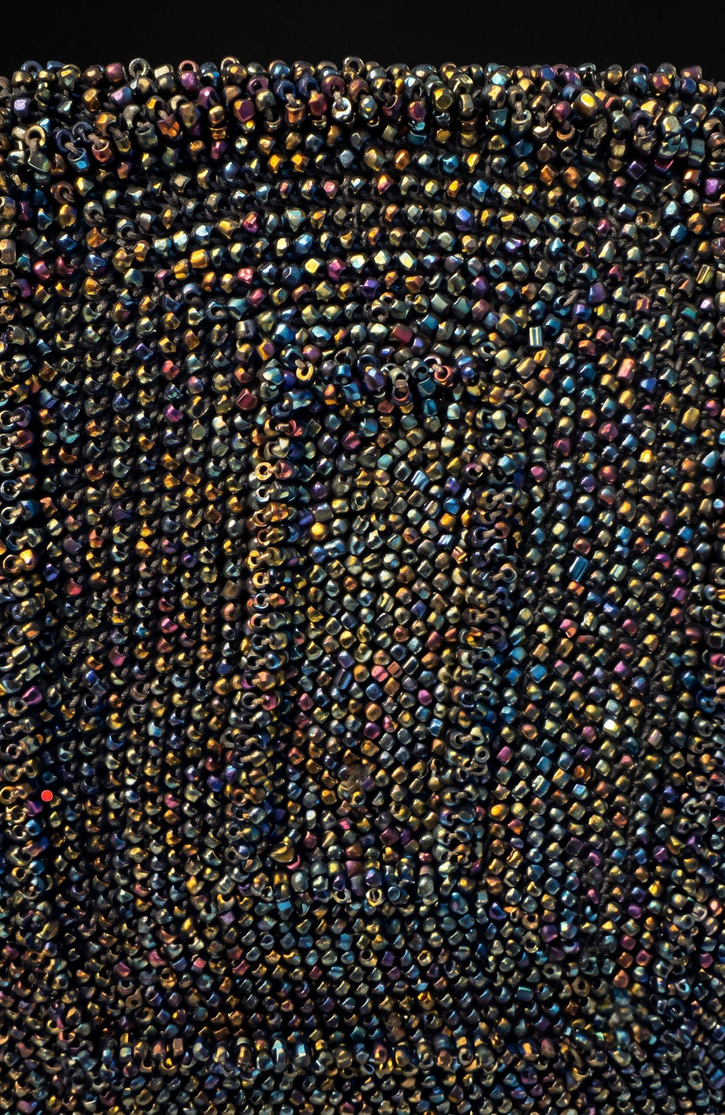 gorgeous 1940s beaded bag with dark green blue and bronze beading. Extra thick handle in mint condition.