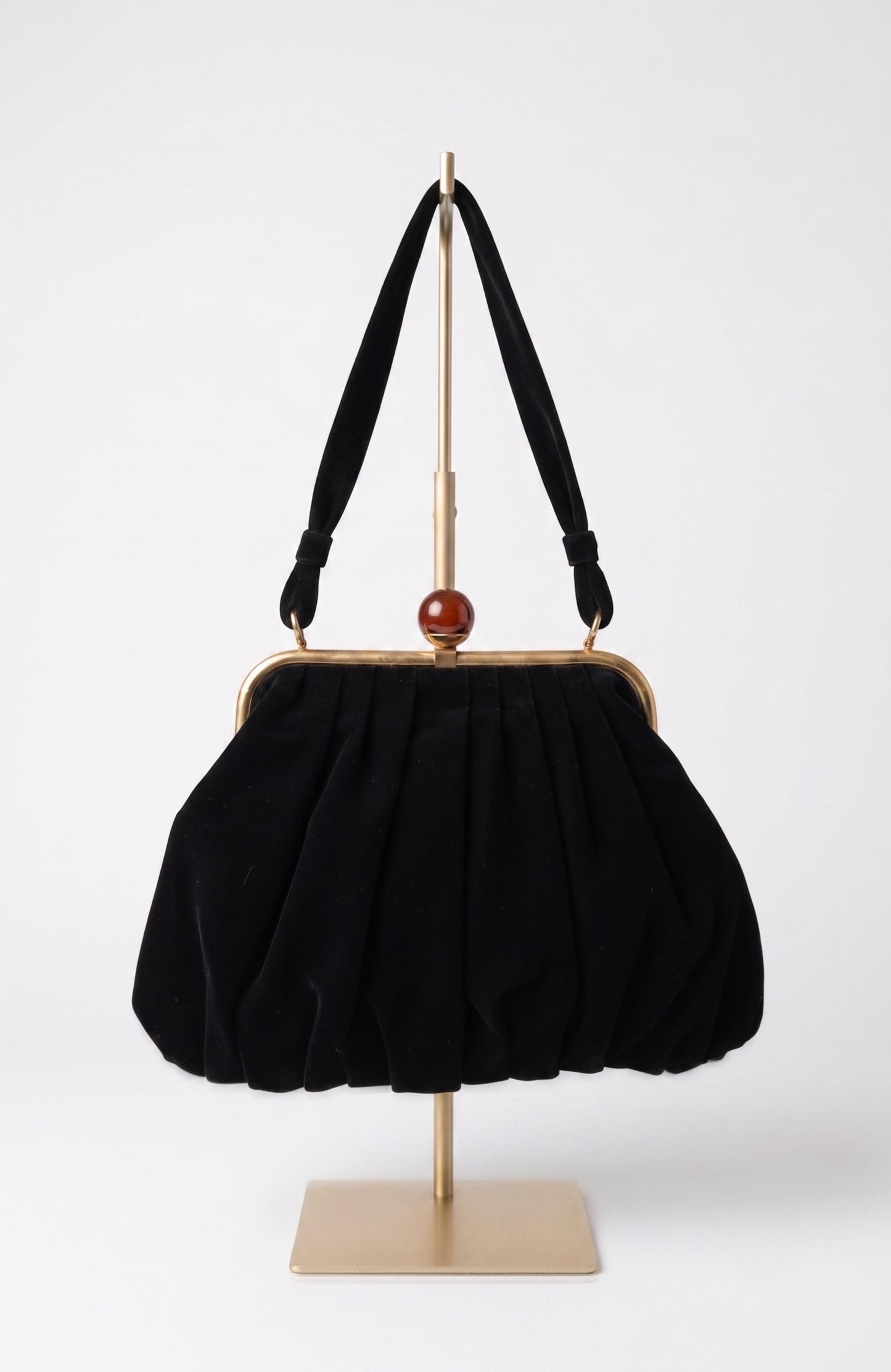 Bag is black suede 1940s with a bakelite top clasp