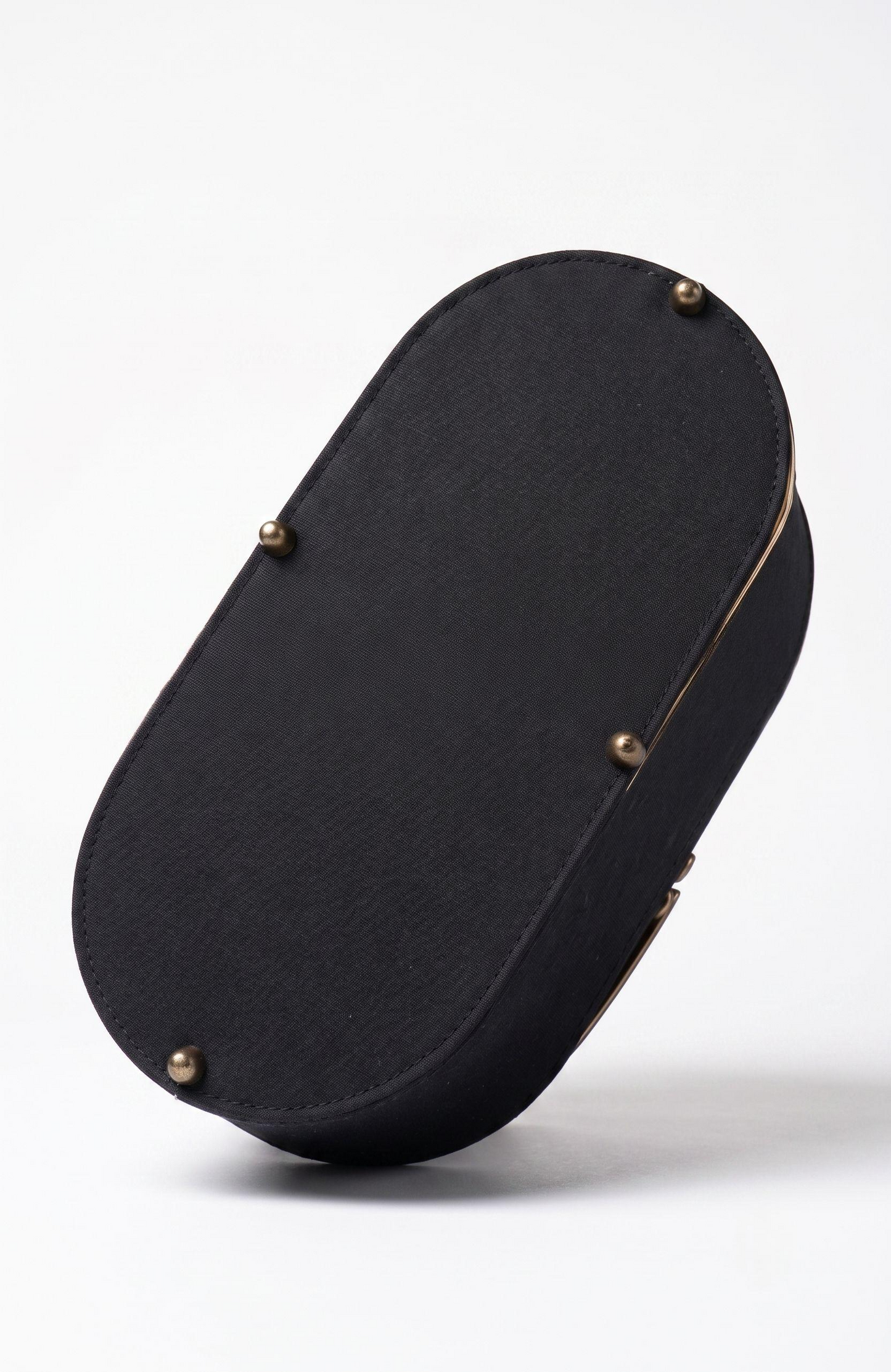 It is a 1940s black suede box Bag with woven suede and gold tone detailing