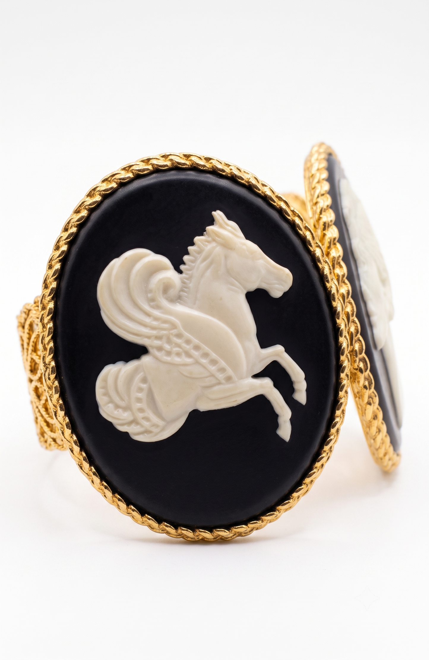 Chanel 1990s carved cameo motif large cuff bracelet with 4-cameo 2" cameo plates featuring a horse, 2 Coco portraits and a renaissance girl.