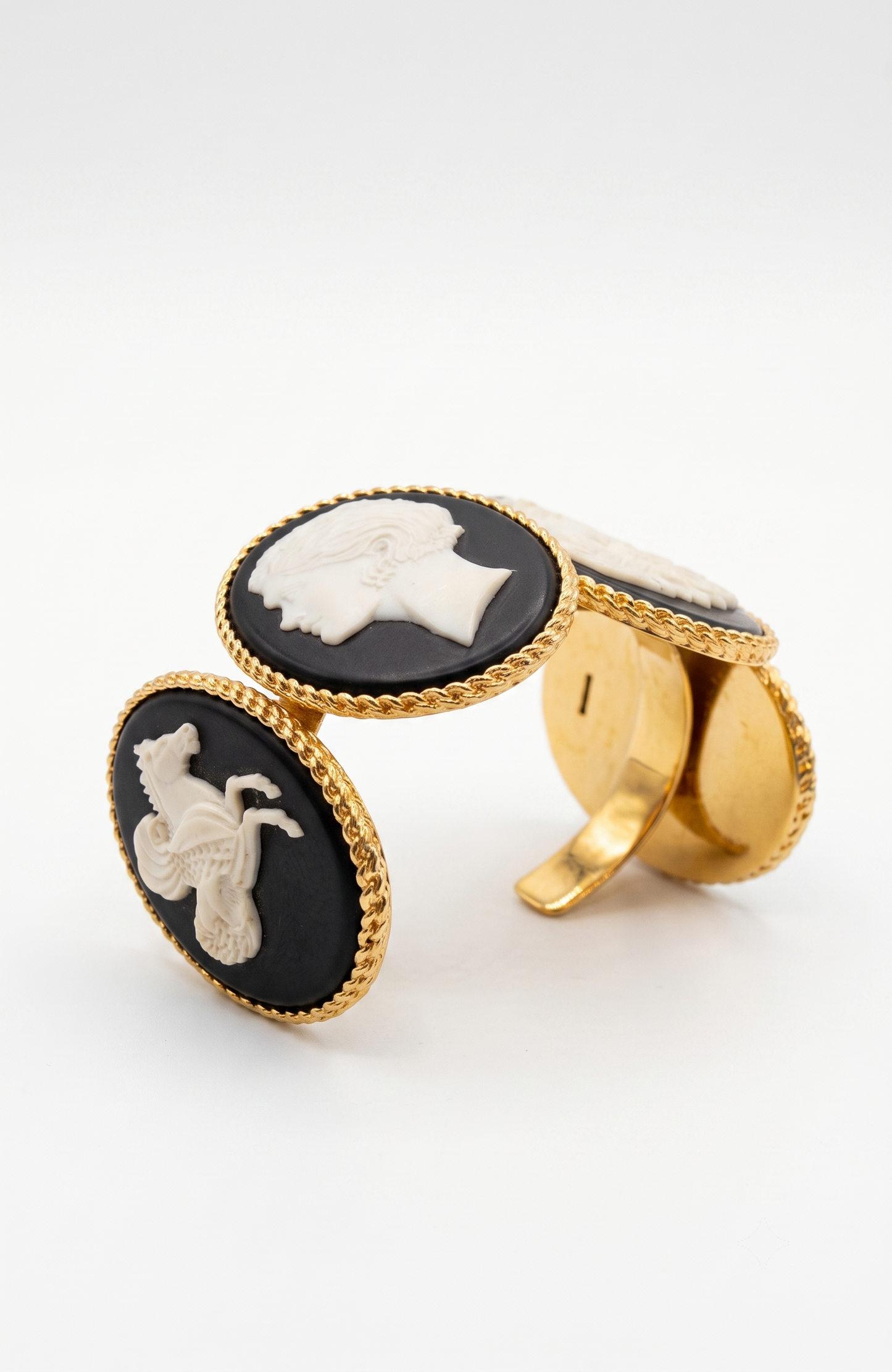 Chanel 1990s carved cameo motif large cuff bracelet with 4-cameo 2" cameo plates featuring a horse, 2 Coco portraits and a renaissance girl.