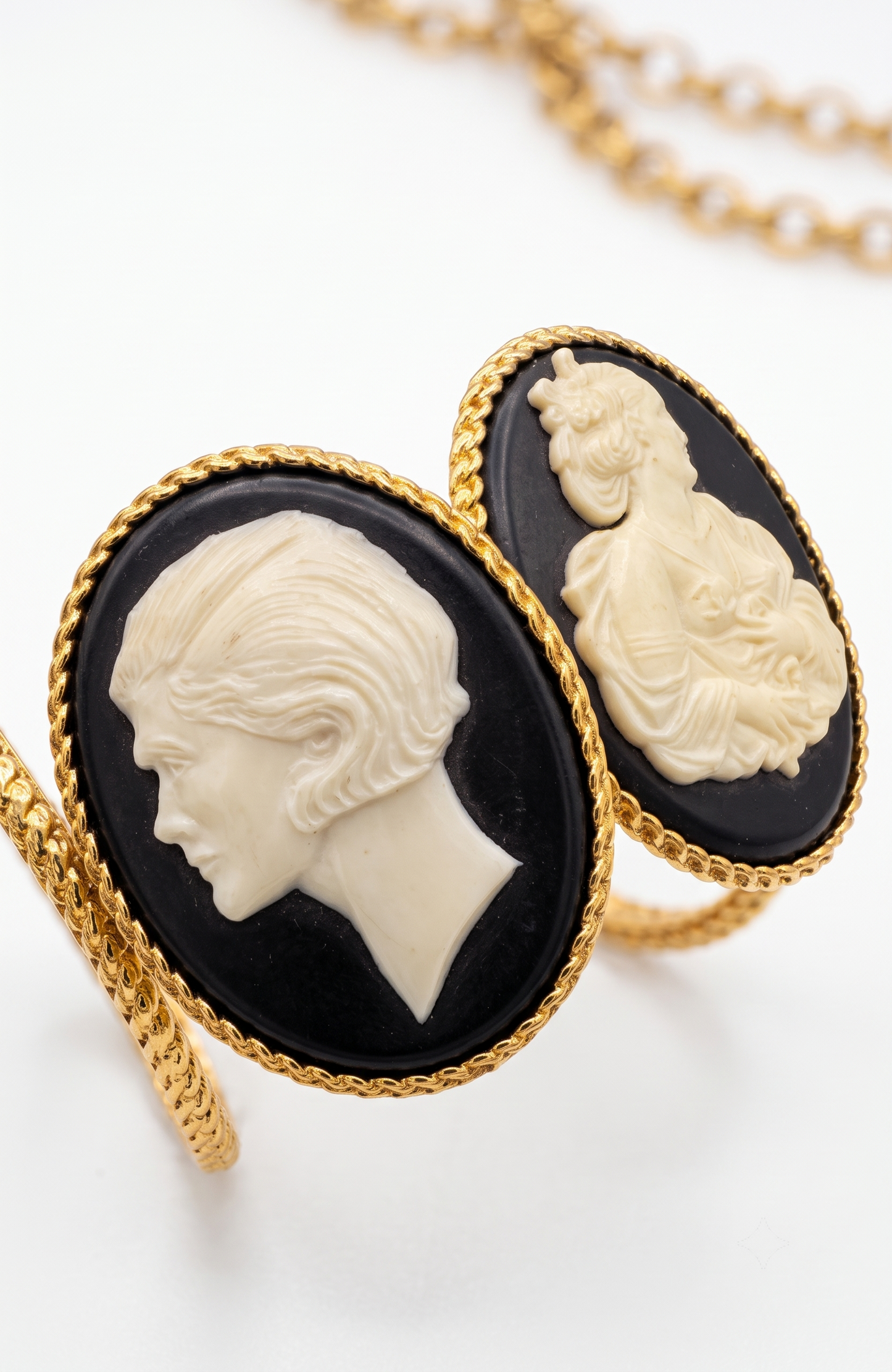 Chanel 1990s carved cameo motif large cuff bracelet with 4-cameo 2" cameo plates featuring a horse, 2 Coco portraits and a renaissance girl.