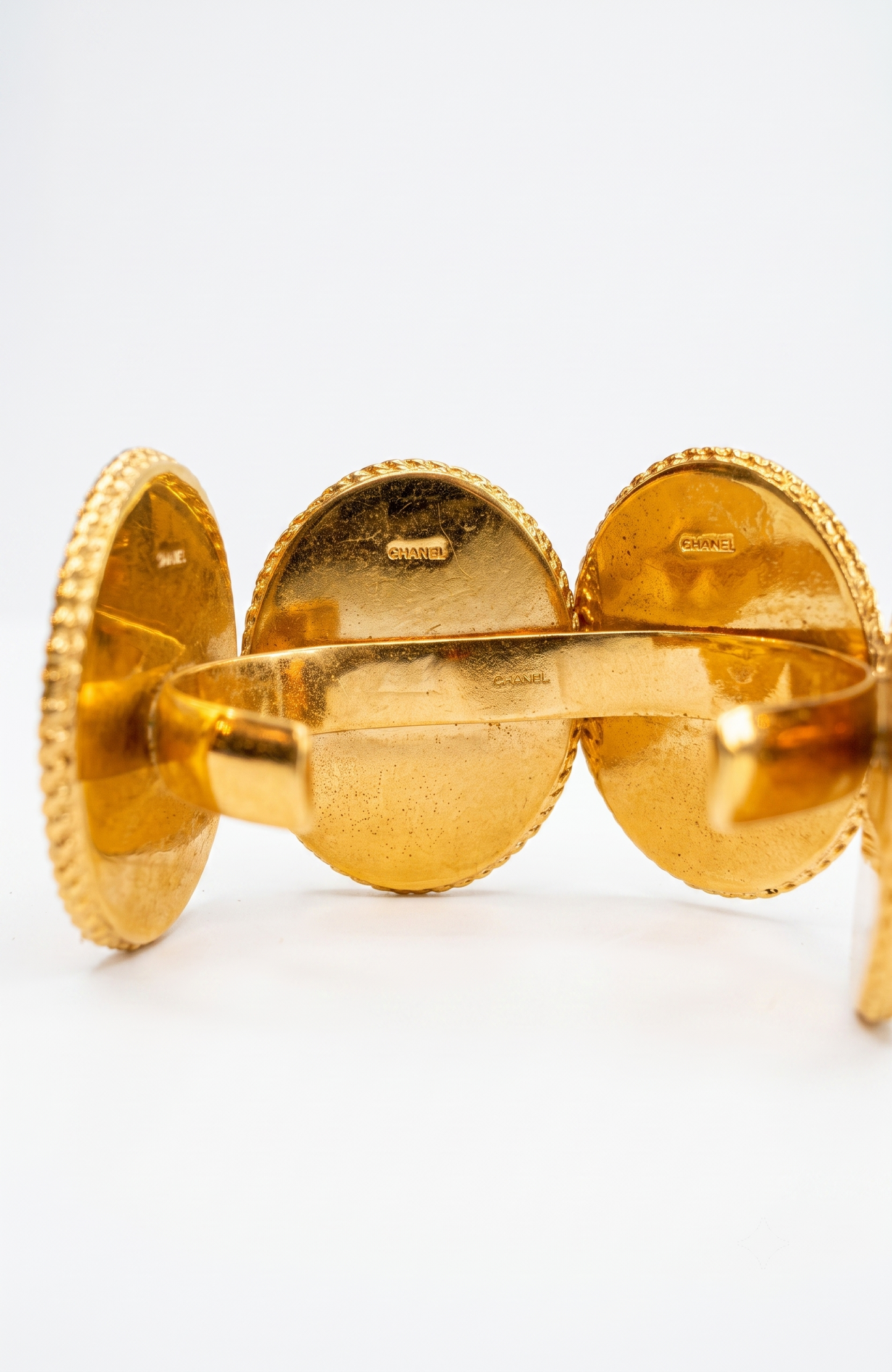Chanel 1990s carved cameo motif large cuff bracelet with 4-cameo 2" cameo plates featuring a horse, 2 Coco portraits and a renaissance girl.