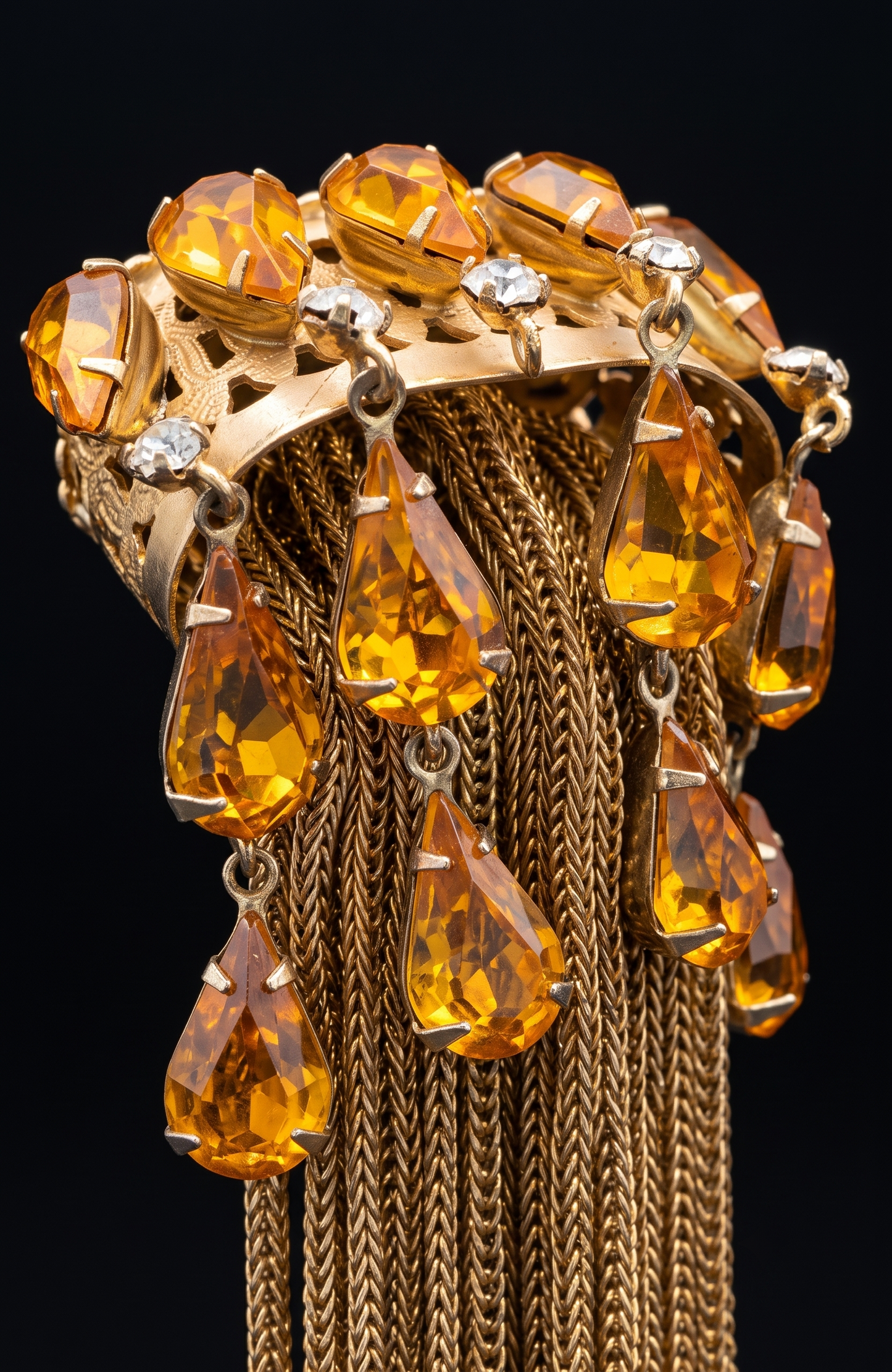 Joseff of Hollywood gold brooch with domed top and cascades of 13 prong set large citrine glass teardrops and 5 round white glass rhinestones w/ tassels.Unsigned Joseff of Hollywood was created for a specific actress for a specific film.
