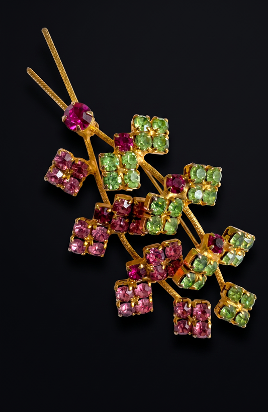 Beautiful mid-century, floral spray, brooch featuring pink and green rhinestones on a gold tone back