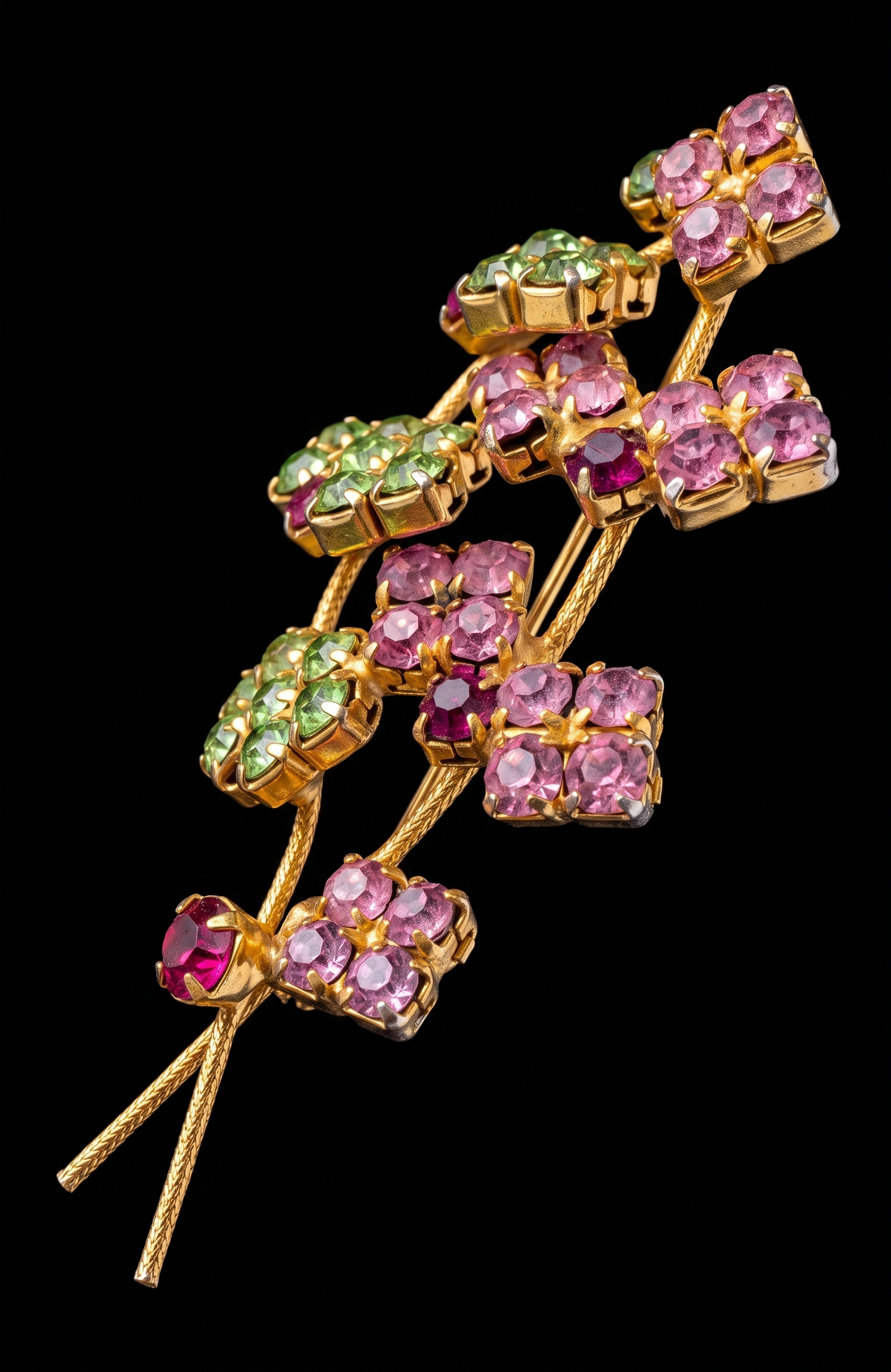 Beautiful mid-century, floral spray, brooch featuring pink and green rhinestones on a gold tone back