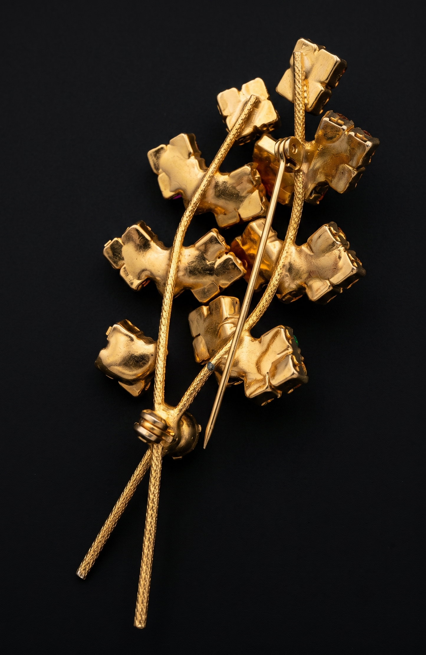 Beautiful mid-century, floral spray, brooch featuring pink and green rhinestones on a gold tone back