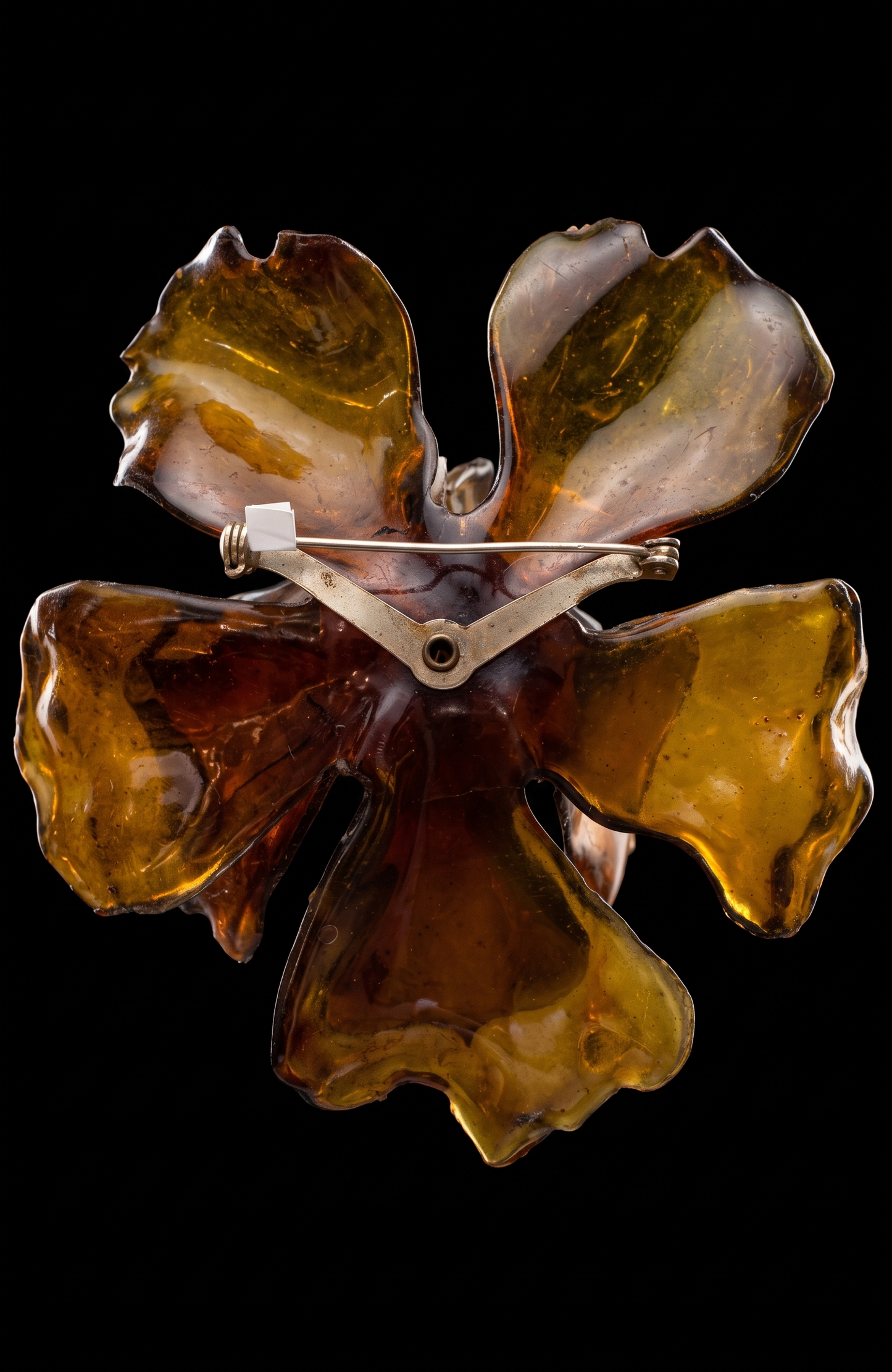1960s giant amber colored lucite brooch with center rhinestones
