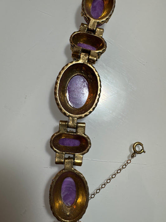 Stunning 1950s bracelet. Gold tone with purple stones and green rhinestones and pearls