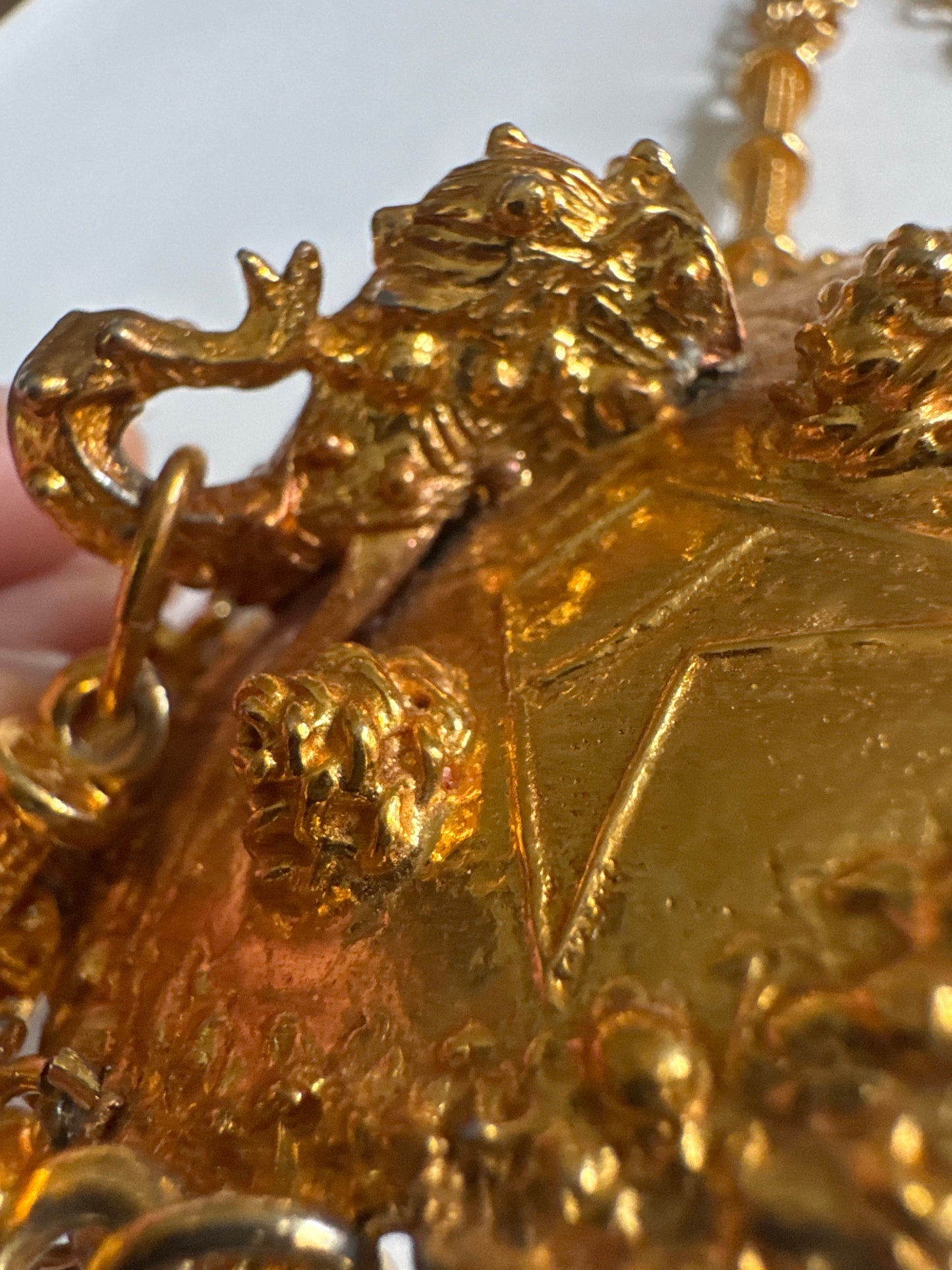 Signed 1960s Pauline Rader signed gold tone necklace. The two elephant heads that dangle at the bottom of the pendant are hollow. Double chains on each side. It's heavy!