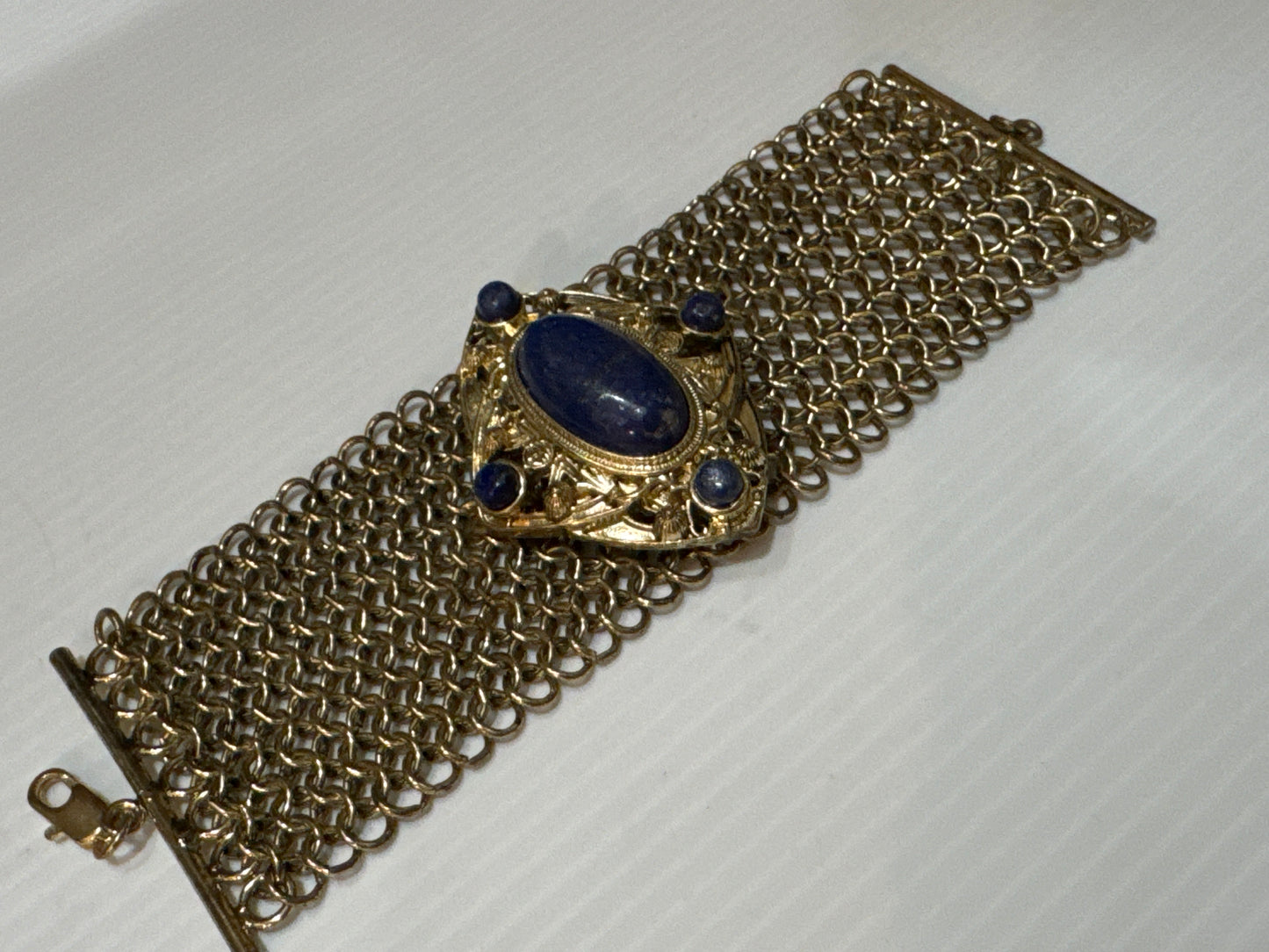 1960s gorgeous gold mesh link bracelet with blue glass cabochons. jackpot