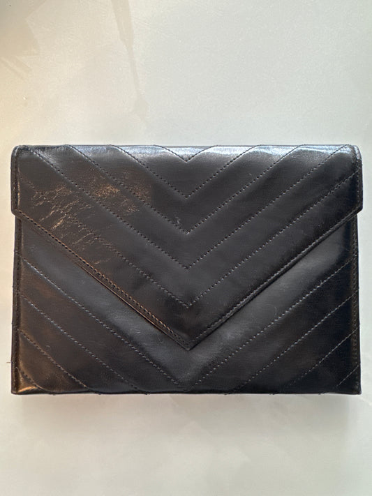 Beautiful vintage YSL lambskin leather. With zipper inside and YSL logo throughout