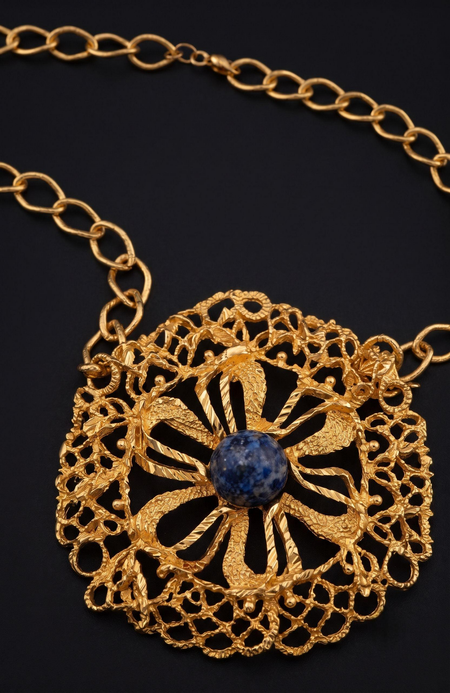 1970s jumbo pendant necklace with blue cabochon stone, and tassels