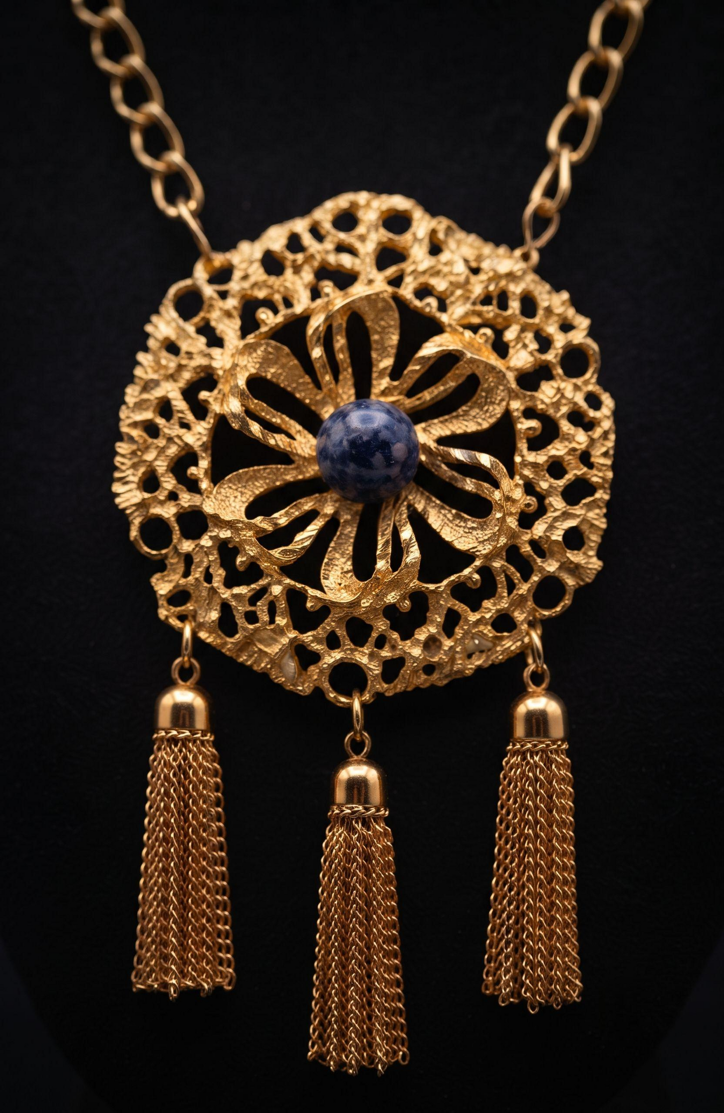1970s jumbo pendant necklace with blue cabochon stone, and tassels