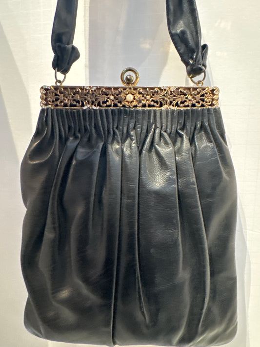 1940s unique leather handbag with decorative hardware