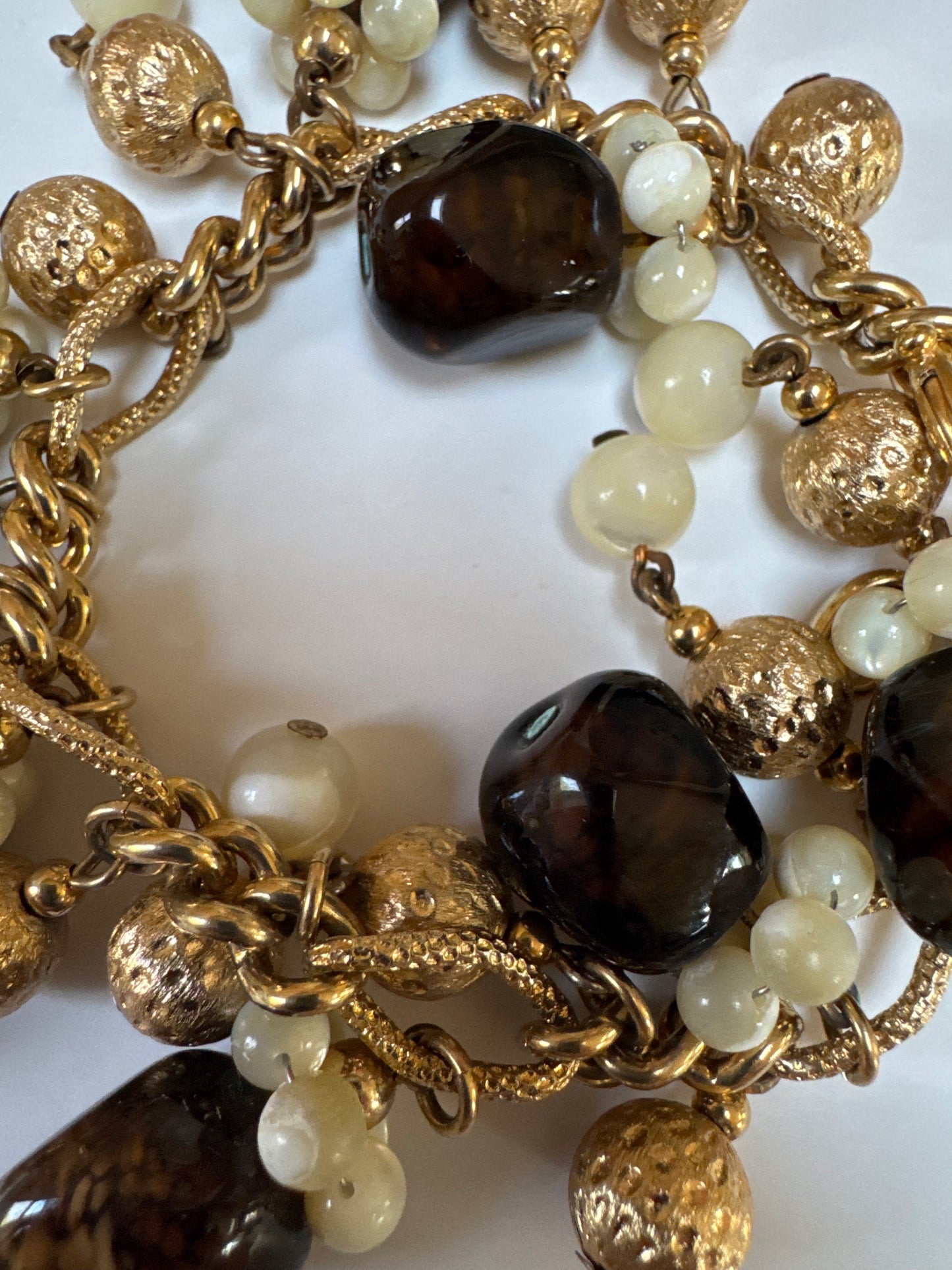 1960s fun signed NAPIER charm bracelet with gold satin balls and root beer Brown lucite dangles